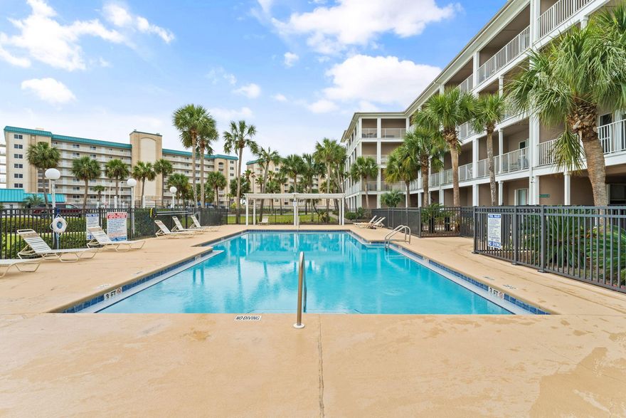 Looking for the perfect beach escape, island lifestyle, or investment opportunity? This beautifully updated third-floor unit at Grand Caribbean on Perdido Key has it all. Fully furnished and ready to enjoy, this condo features a spacious L-shaped balcony with views of the sparkling pool and glimpses of the Gulf of Mexico beyond the palm trees. Inside, you'll find a stylishly updated living area with a updated furnishing to include the living area couch, tables, lamps, artwork, and dining set. The kitchen and bathroom boast upgraded cabinetry and elegant granite countertops. Comfort and convenience are assured with a newer HVAC system installed in 2020 and a stackable washer/dryer. Fresh LVP wood-look flooring throughout adds a touch of modern charm. A built-in bunk bed alcove in the hallway offers extra sleeping space, and the memory foam sleeper sofa ensures this unit comfortably accommodates up to six guests. Grand Caribbean is a well-maintained, gated community with fantastic amenities, including elevator access, a seasonally heated pool, a hot tub, BBQ and picnic areas, and a pavilion by the freshwater pond. Enjoy beach access via a boardwalk making your fun-filled beach days easily accessible. Relax on the sugar-white sands or swim in the emerald waters. For those who love the outdoors, a scenic sidewalk along Johnson Beach Road leads to the Gulf Islands National Seashore. Nearby, you'll find a variety of restaurants, shopping, entertainment, and sporting activities. Whether you're seeking a relaxing beach retreat or a lucrative investment, this stunning property offers endless possibilities. Embrace the beach life and make it yours today!