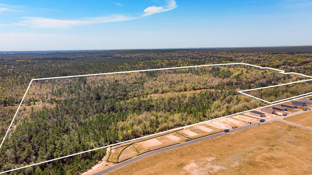 Located just north of Crestview, this homesite is one of very few 100+ acres available in Crestview. This sale includes the purchase of 3211 Maple St, a 2042SF brick home built in 1967 with 3 bedrooms and 2 baths. A new roof was installed in 2020. This parcel is a majority of the acreage at over 100 acres. The second home, 3205 Maple St was built in 1963 and has wood/vinyl siding 2 bedrooms 1.5 baths and is 980sf and a roof was installed in 2023. Due to the combination of properties, acreage size, limited financing is available. A definite must consider if looking for your next build site, farm, pasture or possible subdivision. Homes are being sold as is. Call today.