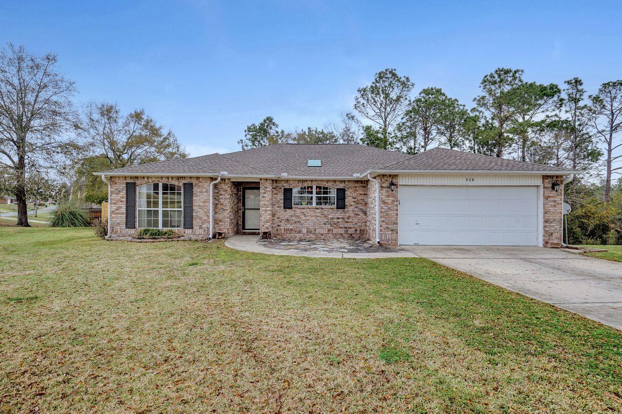 Large corner lot with tons of curb appeal! This fantastic 3 bedroom/ 2 bath brick home located in South Crestview is perfectly located for Duke, 7th Group, Eglin or even Hurlburt Field commutes. Large open floorpan with tile flooring throughout the living, dining and kitchen. Huge formal dining room on the front of the house could be used as office or flex space. Granite counters and stainless steel appliances in the large bright eat-in kitchen with a large window over the sink. Large bedrooms with a split floor plan. Master bathroom is huge with two walk in closets, dual sink vanity, separate shower and large soaking tub. Screen porch/Florida room off the back has tons of space for dining/ living areas. Brick paver patio with built in firepit is perfect spot for evening drinks and...