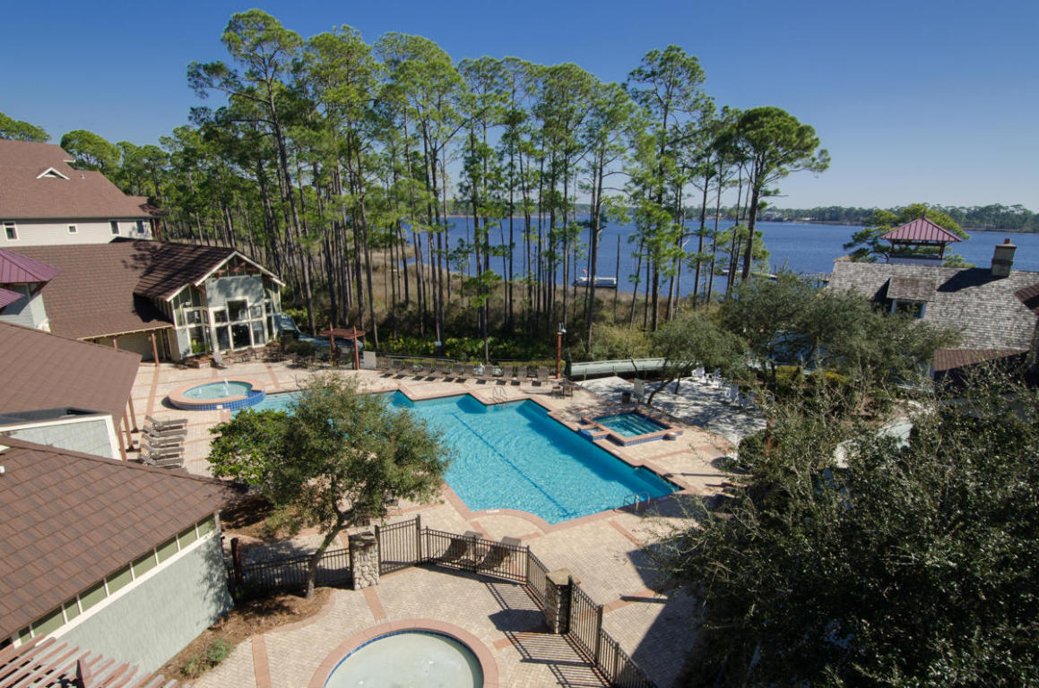 Wild Heron is the best kept secret on Florida's Emerald Coast. This is a stunning 4-bedroom, 3.5 bath condominium on Lake Powell in award winning Wild Heron. Lakeside Lodge at Prospect Point is truly the most desired address in this gated 750-acre coastal sanctuary. Located just minutes from 30A and Rosemary Beach. Seaside and Watercolor are both just a short drive away and it's about a 20 minutes or so to Sandestin, with the fabulous Pier Park just six miles away. Overlooking the glorious Lake Powell, which is 1 of only 41 ''Florida Exceptional Waterway's'', the wildlife and sunsets are unforgettable! This luxurious light filled condo has a spacious 80 foot wrap-around balcony with gas hook up and beautiful floor to ceiling windows designed to enhance its views of Lake Powel