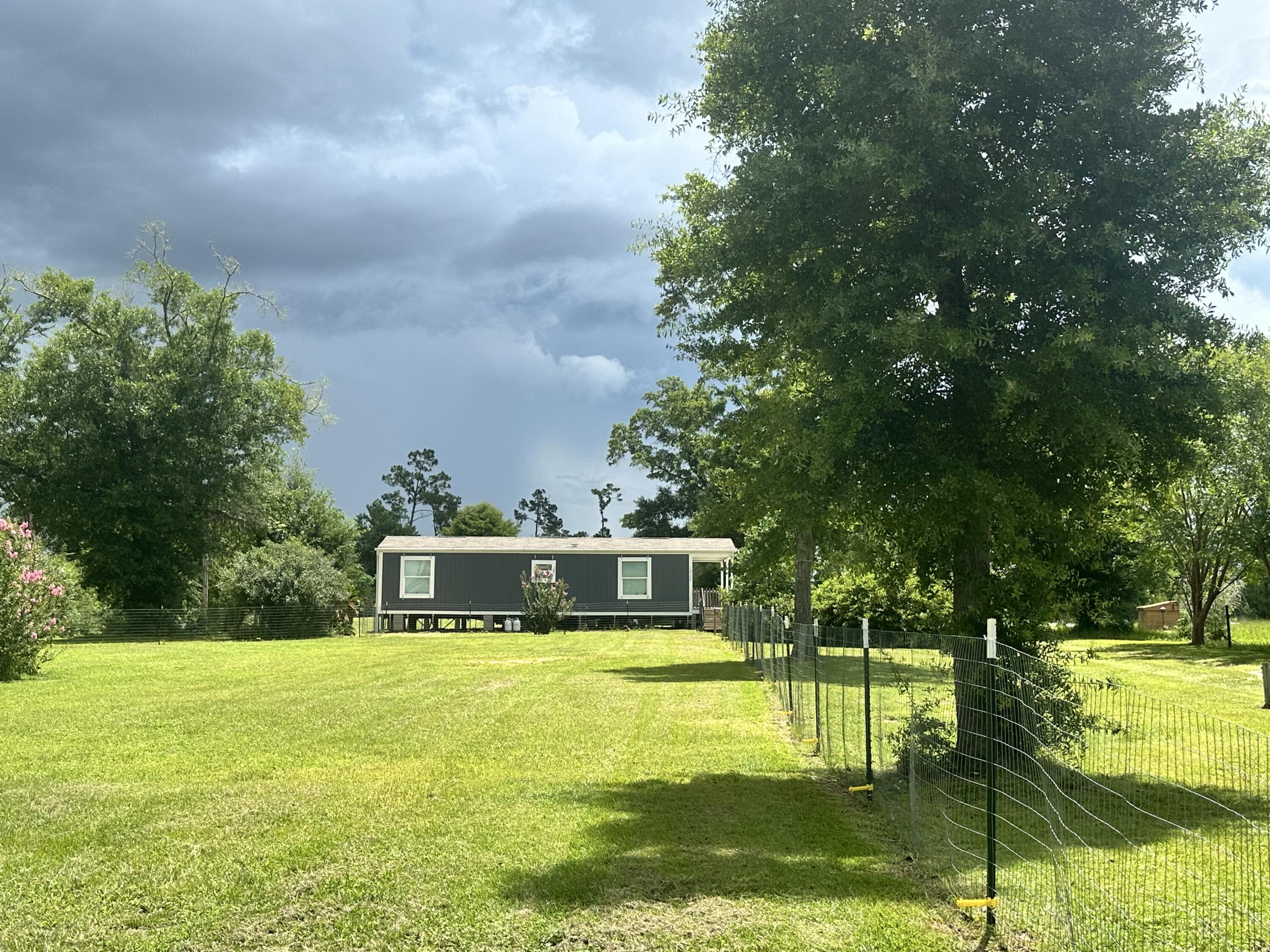 Country Living on 5 Acres!Don't miss this unique opportunity to own 5 peaceful acres in a quiet country setting. This property features a 1-bedroom, 1-bath mobile home--ideal as a full-time residence, weekend retreat, or temporary housing while you build your dream home.The land is equipped with a 3-bedroom septic system, providing flexibility for future expansion. A large pole barn on-site includes water access and a 50-amp RV hookup, making it perfect for storage, a workshop, or hosting guests with an RV.Whether you're looking for space to grow, build, or simply enjoy a more private, rural lifestyle--this property offers the foundation and freedom to make it your own. Schedule your private showing today!