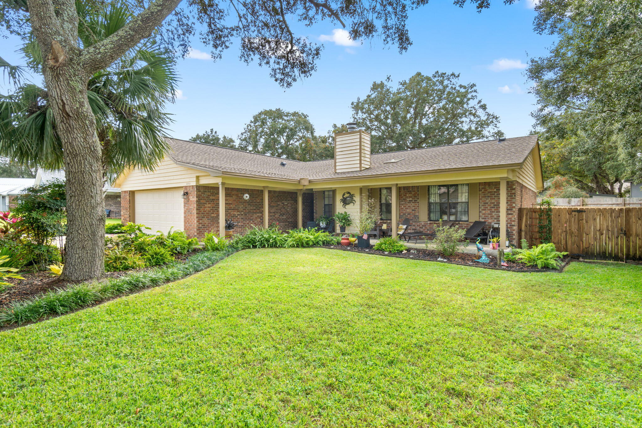 Welcome to this charming 3 bedroom, 2 bath, 2 car garage home nestled in a quiet cul de sac in Sandpiper Village in Gulf Breeze! Loaded with seller updates! Starting with the GORGEOUS landscaping for excellent curb appeal! This split floor plan home is perfect for anyone with a commute to Pensacola, Navarre, Milton, and surrounding areas. Step inside to find the cathedral ceiling in the main living area that opens up the space for a light and airy feel and seamless flow between the living, dining, sun room, and kitchen areas. The kitchen was completely updated with sleek, quartz countertops, brand-new  cabinetry, gorgeous backsplash, recessed lighting, Maytag stainless steel appliances, and a kitchen peninsula for plenty of counter space and casual dining at the breakfast bar! Tiled floor throughout the home. The primary suite is complete with a beautifully updated ensuite with a quartz topped double vanity, lighted and dimmable mirror, huge walk-in closet, and a separate sitting room/office just off the opposite side of the room. The remaining 2 bedrooms and fully updated bathroom with walk-in tiled shower are on the opposite side of the home. 5 minutes to Gulf Breeze Proper, 10 minutes to Pensacola Beach - this move-in ready home is waiting for you!