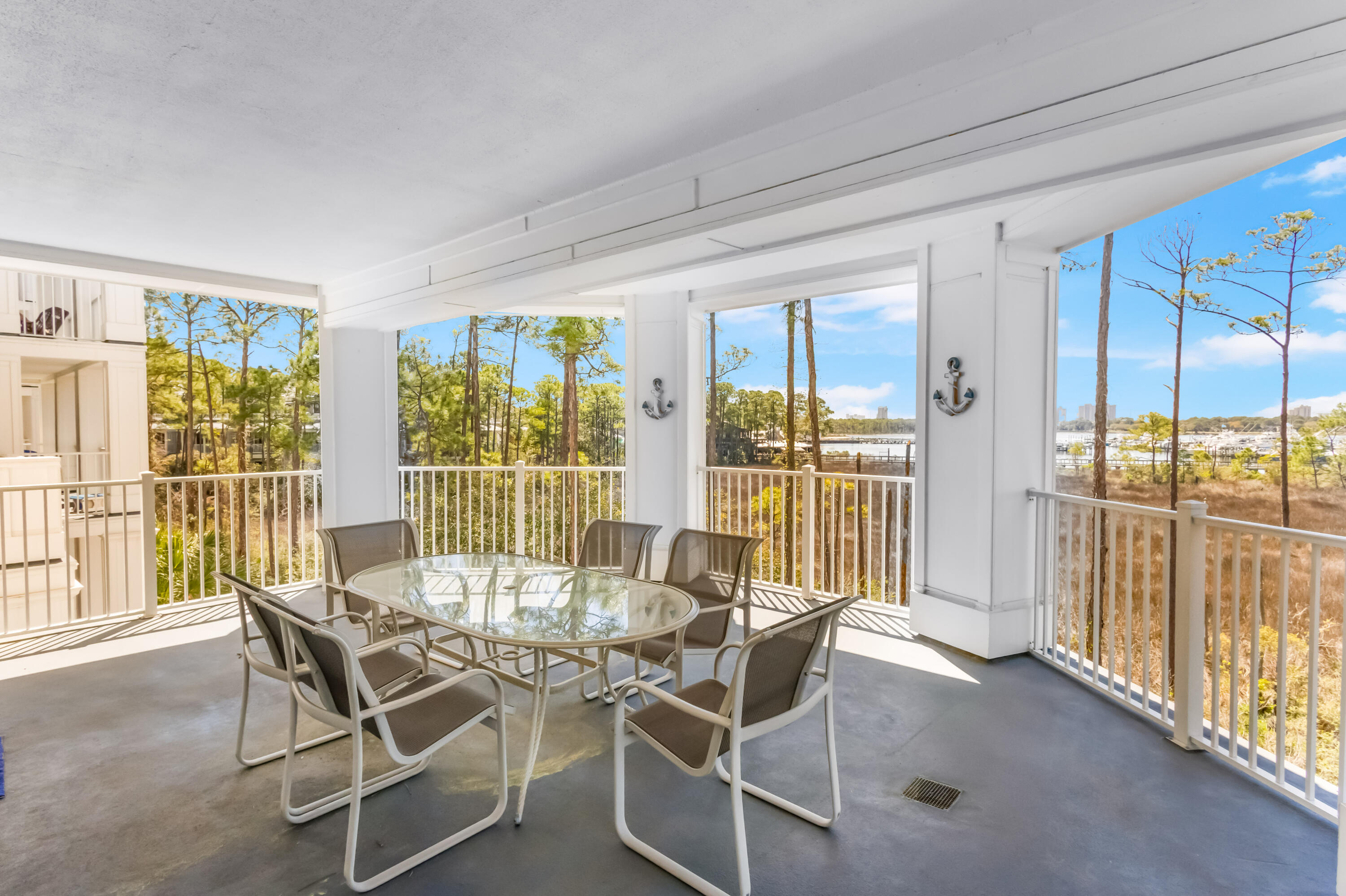 Discover the pinnacle of coastal elegance in this stunning condo located in Lasata, where every detail is meticulously crafted for unparalleled comfort and sophistication. This exquisite property features an oversized semi-circle balcony, offering breathtaking, panoramic views of the Baytowne Marina and Choctawhatchee Bay, setting the stage for idyllic relaxation or grand entertaining.Inside, the condo is a masterclass in luxury, boasting not one, but two master suites, along with a guest bedroom, all of which enjoy the splendid bay vistas. The living area impresses immediately with its floor-to-ceiling windows, enveloping the space in natural light and capturing the serene beauty of the bay, instantly captivating guests with its refined elegance. The interior flows seamlessly, adorned with porcelain plank tile flooring that enhances the condo's sleek, contemporary vibe, complemented by white quartz countertops and stainless appliances in the kitchen.
Crafted for versatility, the generous floor plan positions this condo as an exceptional choice for a primary residence, a luxurious family escape, or a premium vacation rental property. Offered fully furnished and rental-ready, it has served as a cherished part-time rental and a beloved second home by the current owners. Commitment to maintenance is evident with both water heaters replaced in 2022 and the HVAC system in 2021, ensuring a turnkey experience for the next owners.
This Lasata condo transcends typical luxury, offering an exclusive lifestyle for those who demand the very best in location, comfort, and class.
As an introduction to the Sandestin lifestyle, we invite our new owners to explore amenities that make Sandestin special. The listing brokerage and seller(s) are presenting the buyer(s) of this property with (2) 90-minute rounds of Tennis court time, a golf foursome at one of our three championship courses, and a round of golf for up to four (4) players at the unrivaled Burnt Pine Golf Club.
Sandestin Golf and Beach Resort features more than seven miles of beaches and pristine bay front, four championship golf courses, 15 world-class tennis courts, a 226-slip marina, a fitness center, spa and celebrity chef dining. Shop, dine and play at the charming pedestrian village, The Village of Baytowne Wharf and more. Inside the gates of the resort, residents enjoy a balanced lifestyle of high-class living, spanning the 2,400 acres from the beach to the bay. Everything within the gates of the resort is accessible by golf cart or bicycle. The entire resort is interconnected by miles of pedestrian, bike and golf cart paths that weave through groves of live oaks, meandering past natural lagoons, fountains, man-made lakes, and meticulously landscaped fairways.