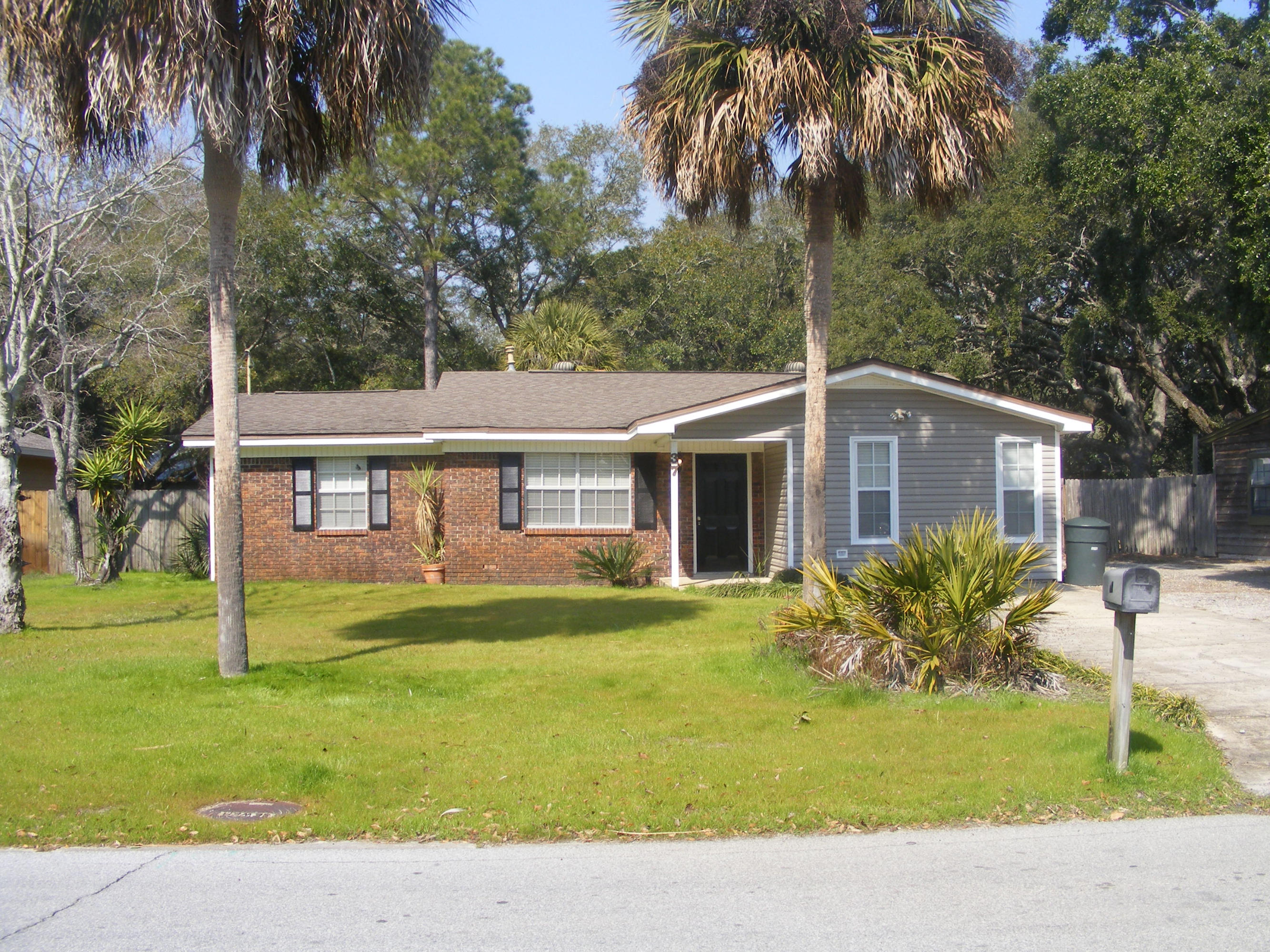 This home is beautifully renovated on a quiet street but still provides close proximity to local schools, shopping and dining. It is also minutes away from the crystal clear waters of the Emerald Coast. This home contains two living areas including a spacious bonus room with exposed brick along with warm wood trim and an extra storage closet. Renovations on this home feature tile floors, 2 in. faux wood blinds, crown-molding and new carpet in bedrooms. The bathrooms are updated with brushed nickel fixtures and solid surface counters. The master bath has a double vanity and modern glass tile in the shower.