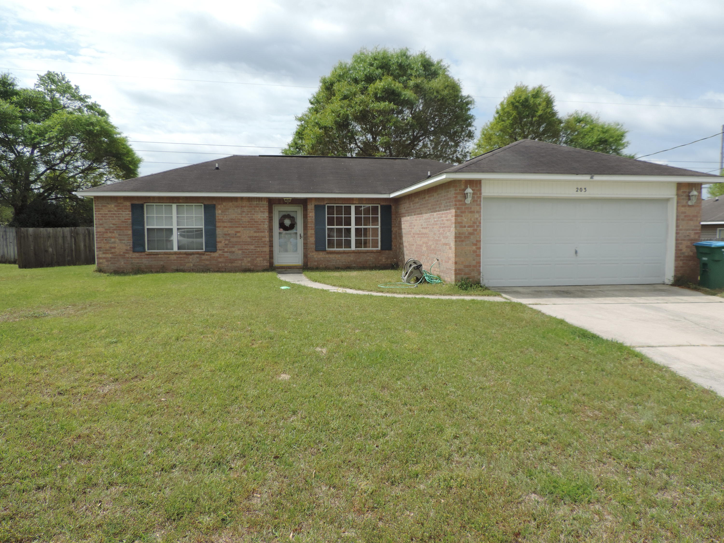Don't get caught in traffic with this South of I-10 location. This wonderful home is ideally situated close to schools, shopping, Eglin and the 7th SFG plus just a short drive to the beautiful Gulf beaches. The home is a 3 bedroom 2 bathroom split bedroom design. The master bedroom is quite large and has room for an office area if you wish. The master bathroom features a double sink vanity as well as a large walk in closet. With tile floor installed throughout clean up and maintenance are cut to a minimum. An open concept kitchen, dining and living room keep everyone in the conversation. Take a look you will be glad you did. The back yard has a wood privacy fence and steel yard building perfect for yard equipment as well as lawn furniture
