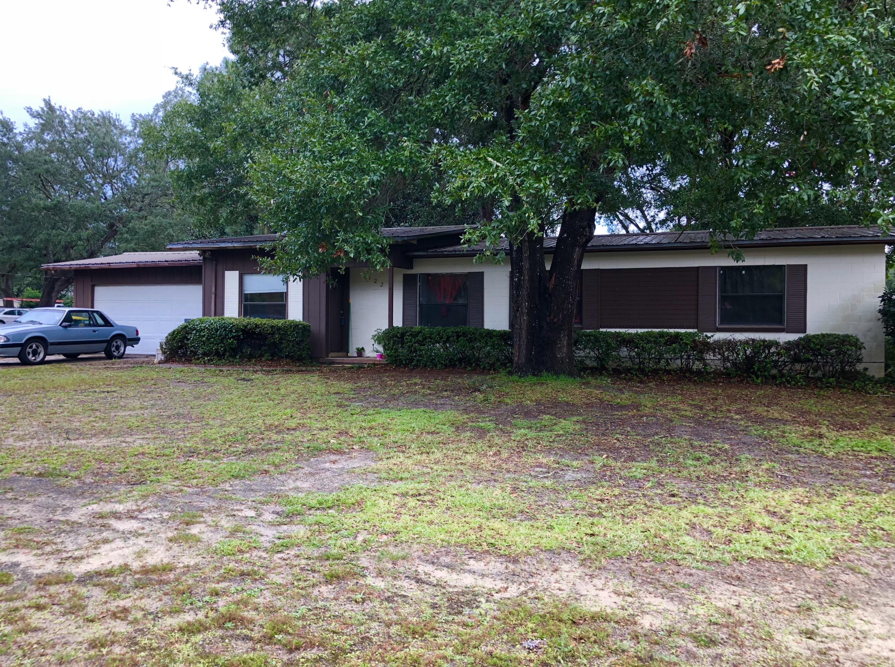 MAJOR PRICE IMPROVEMENT!! SELLER MUST SELL AND MOVE FOR NEW JOB.........BEST SCHOOL DISTRICTS.....Owner moving with work!!!Three bedroom home in Niceville! Huge lot, fenced back lawn, 2 car garage, almost zero maintenance includes metal roof, Out building for additional storage, Gorgeous naval live oak trees in lawn. Both refrigerators, washer & dryer stay.