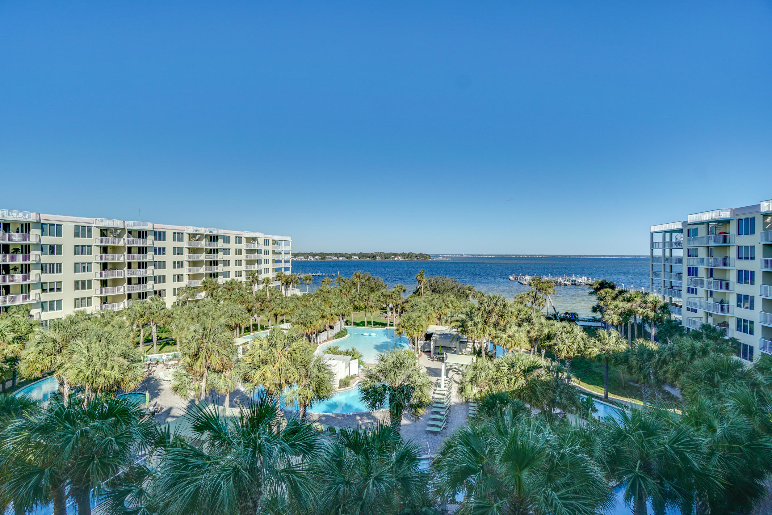 Take in the expansive view of the Bay from your 6th floor private balcony. This lovely condo is ready for you to make vacation memories and/or cash in on rentals. The 700' lazy river pool, multiple onsite pools, beach access , hot tubs, fitness center, are just some of the great amenities at Destin West. Fully furnished. There is even a Marina with 25 private dock slips. The sky bridge makes it easy to enjoy the bay and the beach. Many fun family attractions nearby. Buyer to verify all information.