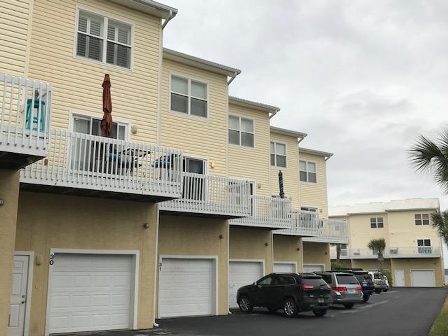 This beautiful 3BR/2BA townhouse sits on the Santa Rosa sound with views all the way to the Navarre bridge. This is a gated community with a pool and lush landscaping that makes it a beautiful place. There are three balconies to enjoy this property from both the back and the front. The layout of this home makes it very convenient for both families and roommate arrangements. The pool is right out your back door and with a ground level covered patio where a grill can be kept, having that summer barbecue will be amazing!All the bedrooms have their own full bathroom ensuite. The half-bath along with the laundry is conveniently located on the second floor. A washer and dryer is include for your convenience as well. The master bedroom on the top floor overlooks the pool and has double glass