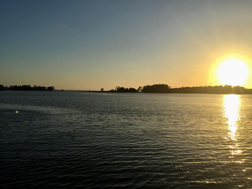 Build your dream home on approximately  1 acre with 98.47 ' on Lagrange Bayou with amazing sunsets.  This lot is close to the mouth of Lagrange and Mallet Bayou which goes out to Choctwhatchee Bay.  City water tap fee has been paid, electric is on the property and fill dirt was put down within the past year.  The dock is approximately 180' with new deck boards which includes approximately a 12' x 25' deck at the end of the dock.  Fish off the dock for Mullet, Redfish, Bass and more.  Watch the Eagle and Osprey soaring thru the skies and dolphin swimming by. Several loads of dirt was brought in to level the lot.