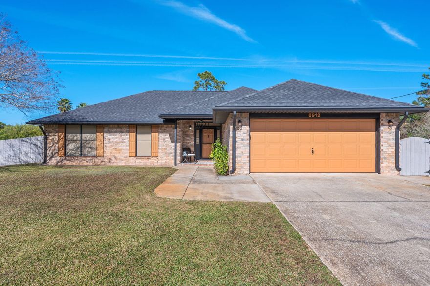 This updated and meticulously maintained home blends refined indoor living with a relaxed coastal lifestyle. Designed for both comfort and entertaining, the home features a newly added covered entertainment patio (24' x 16') with custom pavers and a firepit lounge area--ideal after a day at the beach or pool. Inside, the living room showcases a custom-built entertainment center, while the kitchen offers custom maple cabinetry and Energy Star appliances, including a gas range. Custom built-in bookshelves in Bedroom #1 and upgraded windows with solar screens enhance both style and efficiency. Major systems have been updated, including roof 2021, HVAC 2020, hot water heater 2023. The fully fenced yard includes an RV 220 line and a workshop with lean-tos and insulated attic storage. Golf course in Hidden Creek