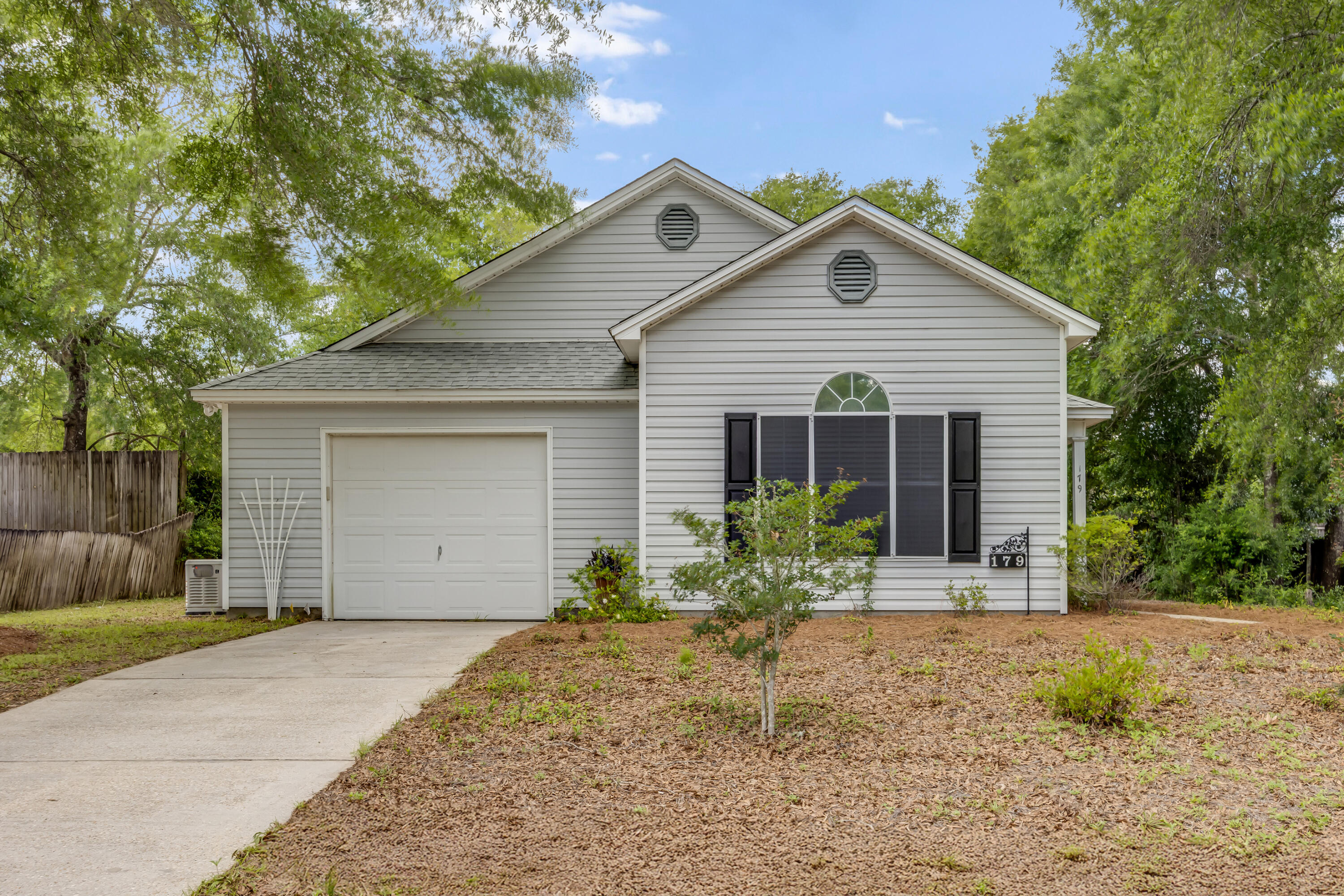 Welcome to your new home in Timber Wind Estates, ideally situated within the city limits of DeFuniak Springs! This affordable, move-in ready 3-bedroom, 2-bathroom residence is perfect for those seeking convenience and comfort. Enjoy the tranquility of this friendly neighborhood while being just minutes away from downtown shopping, dining, and the scenic Lake DeFuniak.The thoughtfully designed split floor plan creates a seamless flow between the spacious living room and the eat-in kitchen, which boasts a gas range and ample cabinet space, including a pantry for added storage. The vaulted ceiling enhances brightness and openness throughout the living area. The primary suite features a walk-in closet and an en-suite bathroom with a shower/tub combo for your convenience. Step outside to the covered back patio, perfect for afternoon barbecues, and a secluded backyard that awaits your personal touch. With updated features including a new roof installed in 2021 and a water heater replaced in 2018, you'll enjoy low-maintenance living. Located just a short walk from Lake Stanley Park, where you can partake in various water activities, this home qualifies for all types of financing and has no HOA fees. Don't miss the chance to make this charming house your home!