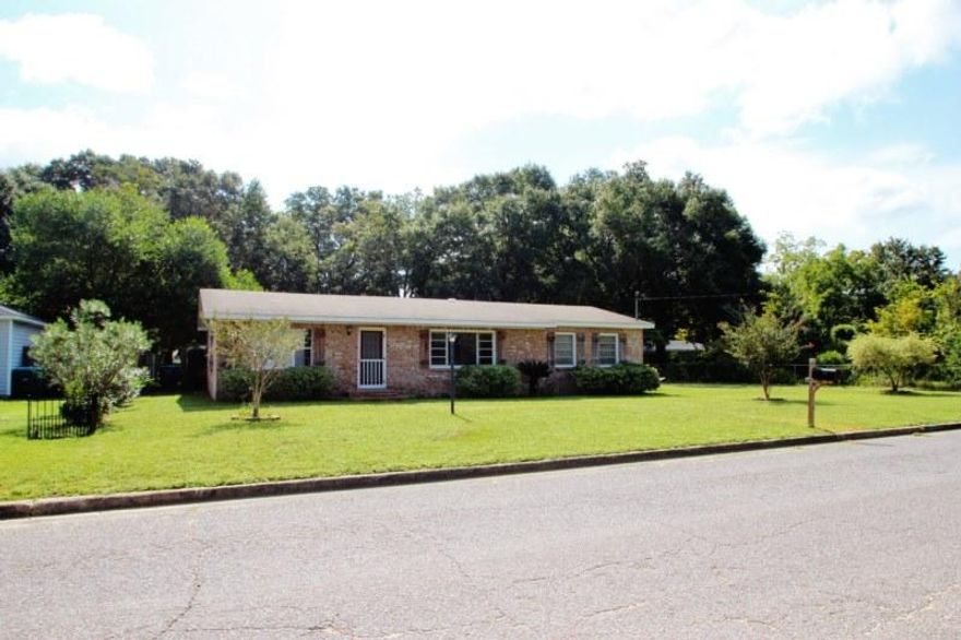 This great property located in central Crestview has several large living areas -- A spacious living room which boasts a private office (see photos), the roomy den or dining room with custom built in wall to wall hutch/bookcases, and the oversized family room. Everyone has a place to go in this home!! Kitchen features an island prep center and a convenient pass through window into the den/dining room, great for entertaining. Kitchen is equipped with a gas range, side by side refrigerator, and microwave. Floor plan includes 3 bedrooms and 2 full baths. Family Room is oversized and is adjoined by a bedroom and full bath. This would make a great mother-in-law quarters, guest suite, or a teen hideaway! Stone paver patio features a unique fire pit, another great feature for entertaining, and