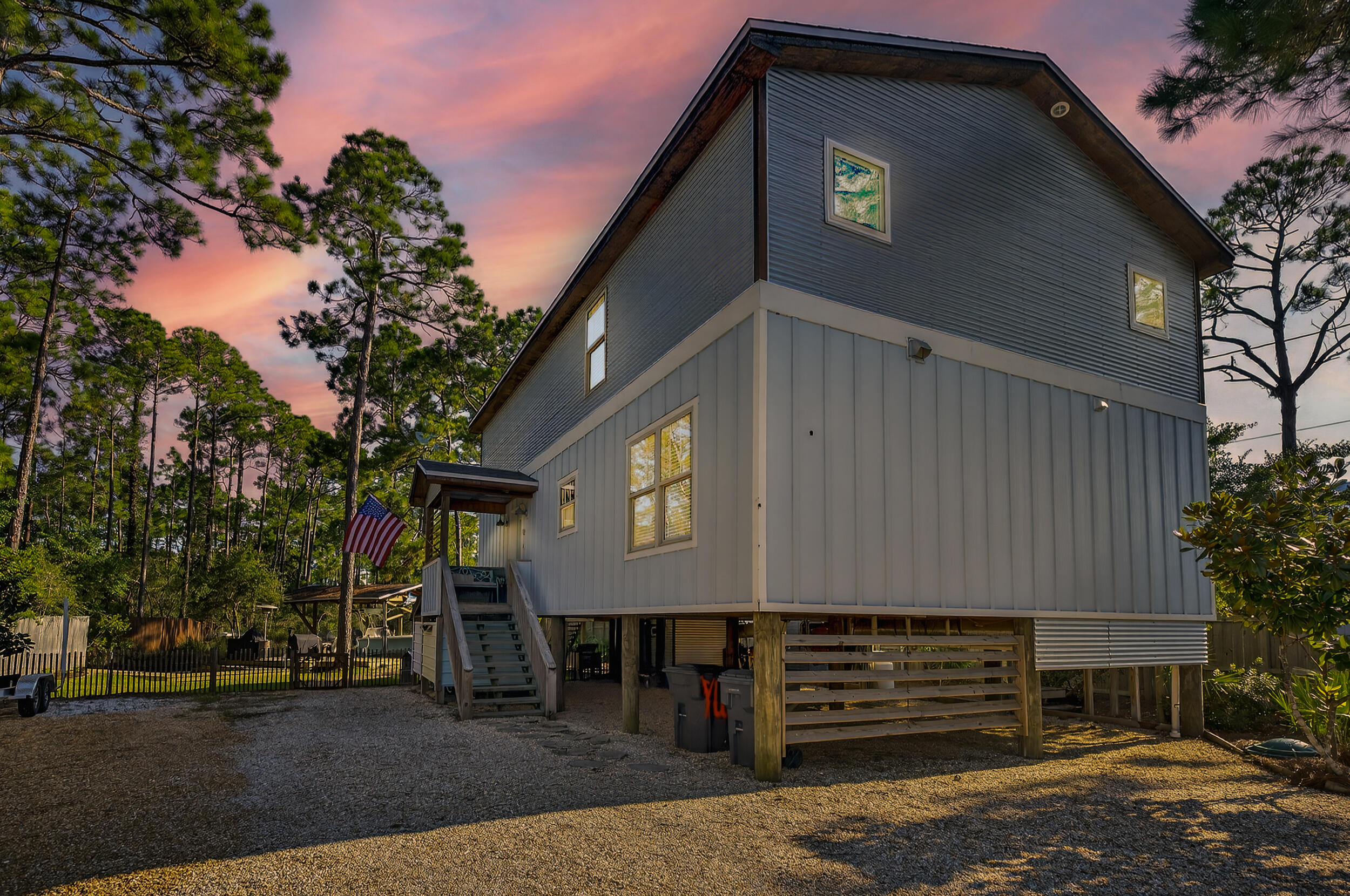 Waterfront living meets rustic craftsmanship in this rare 3-bedroom, 2-bath home with 1,664 sq. ft. of character and charm. Perfectly set on more than half an acre with private dockage with boatlift and shallow-water access to Choctawhatchee Bay, this property is a dream for boaters, anglers, and anyone who loves life on the water.From the moment you step inside, you're greeted by soaring ceilings, exposed beams, and rich wood finishes that give the home a warm, lodge-like feel. Salvaged and repurposed materials from a local farmhouse have been carefully integrated throughout, from the aged pine floors to the custom-built details that add a sense of timeless craftsmanship. The open living area flows into a rustic yet modern kitchen featuring open shelving, a farmhouse sink and a large center island designed for gatherings. Two additional bedrooms are located in the loft-style upper level, each offering unique layouts and built-in features that make them both functional and full of character, as shown in the photos.
This home was built with longevity in mind, featuring hurricane-rated windows and doors, spray foam insulation, and deep-set structural posts for strength and stability. Outside, a screened porch overlooks the fenced backyard, while the under-house area provides creative storage finished with mahogany wood salvaged from a historic boat.
The waterfront lifestyle is truly at your fingertips with a private boathouse, covered slip, kayak rack, and fish cleaning station ready for your adventures. There's ample parking inside the gated drive for multiple vehicles, RVs, and water toys. Whether you're setting out on the bay for a day of fishing, paddling through Hogtown Bayou, or heading just minutes away to the white sands of 30A, this property offers the best of Florida's Emerald Coast.
More than just a home, this is a retreat where nature, craftsmanship, and coastal living come together.
