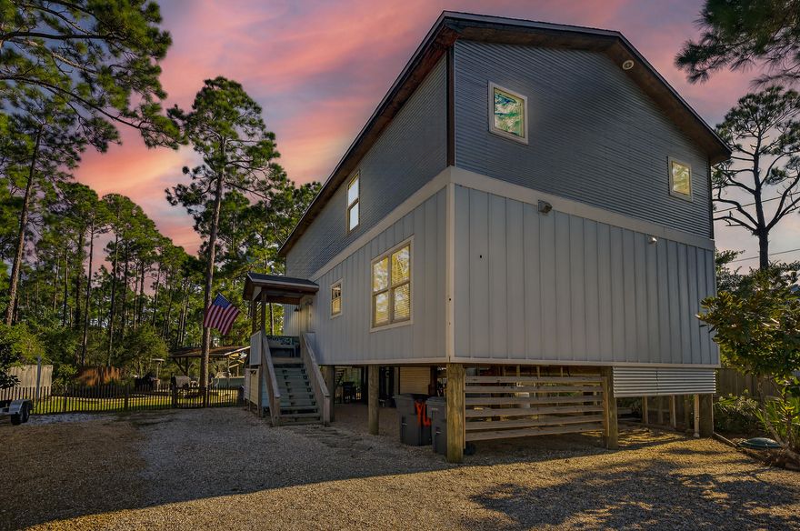 Waterfront living meets rustic craftsmanship in this rare 3 bedroom, 2.5 bath home with 1,664 sq. ft. of character and charm. Perfectly set on more than half an acre with private dockage with boatlift and shallow-water access to Choctawhatchee Bay, this property is a dream for boaters, anglers, and anyone who loves life on the water.From the moment you step inside, you're greeted by soaring ceilings, exposed beams, and rich wood finishes that give the home a warm, lodge-like feel. Salvaged and repurposed materials from a local farmhouse have been carefully integrated throughout, from the aged pine floors to the custom-built details that add a sense of timeless craftsmanship. The open living area flows into a rustic yet modern kitchen featuring open shelving, a farmhouse sink and a large center island designed for gatherings. Two additional bedrooms are located in the loft-style upper level, each offering unique layouts and built-in features that make them both functional and full of character, as shown in the photos.

This home was built with longevity in mind, featuring hurricane-rated windows and doors, spray foam insulation, and deep-set structural posts for strength and stability. Outside, a screened porch overlooks the fenced backyard, while the under-house area provides creative storage finished with mahogany wood salvaged from a historic boat.

The waterfront lifestyle is truly at your fingertips with a private boathouse, covered slip, kayak rack, and fish cleaning station ready for your adventures. There's ample parking inside the gated drive for multiple vehicles, RVs, and water toys. Whether you're setting out on the bay for a day of fishing, paddling through Hogtown Bayou, or heading just minutes away to the white sands of 30A, this property offers the best of Florida's Emerald Coast.

More than just a home, this is a retreat where nature, craftsmanship, and coastal living come together.