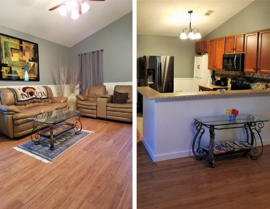 Beautifully updated 3 bedroom, 2 bathroom with vaulted ceiling in the spacious open living room, kitchen, and dining areas. New Berber carpeting in all bedrooms and new laminate wood flooring throughout living area and hallway. Home has a single car carport which could be converted to a garage or 4th bedroom if needed. Large storage building already has interior walls to convert to living area or workshop, with open deck. Additional driveway and parking area on opposite side of lot from the concrete driveway leading to the carport. Central air/heat, city water and septic. Leaving some furniture, decor, and washer/dryer is negotiable. *Exterior photos to be added upon completion of landscape updating.* *3rd bedroom not photographed as it is used for box storage by owner.*