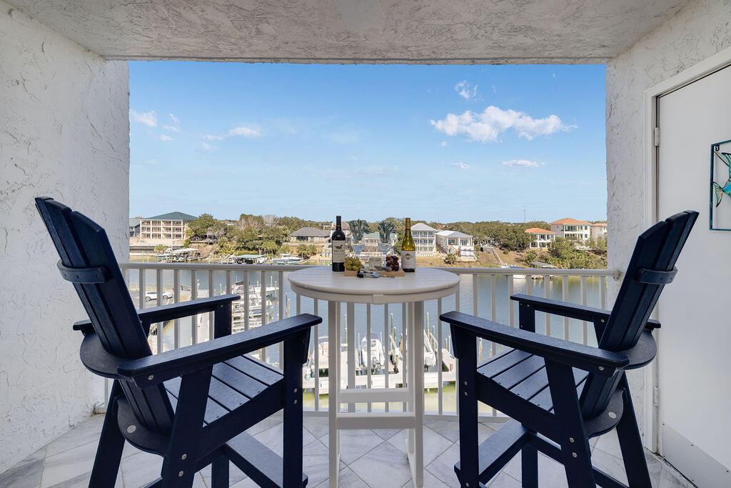 Does it get any better than this?? A Beautifully completely renovated ($72,000 spent) Harbor Front Condo with a major price reduction and an owner committed to pay a $10,322 assessment with an acceptable offer to put a beautiful new gate and fence around the entire Dolphin Point property. You'll have 'Happiness on the Harbor' with everything turnkey for a carefree lifestyle. Enjoy all the amenities at Dolphin Point with a large crystal-clear pool, private beach, tennis courts, clubhouse, and so much more! This coastal inspired home offers an Open-Concept decorated with a 24-foot Shiplap wall, new pieces of furniture, very tasteful artwork, and a prime location to get to the pristine Beach & Emerald Green waters of the Gulf. Come see it today...make it yours...and love it forever!