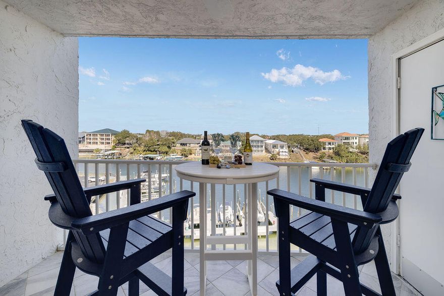 Does it get any better than this?? A Beautifully completely renovated ($72,000 spent) Harbor Front Condo with a major price reduction and an owner committed to pay a $10,322 assessment with an acceptable offer to put a beautiful new gate and fence around the entire Dolphin Point property. You'll have 'Happiness on the Harbor' with everything turnkey for a carefree lifestyle. Enjoy all the amenities at Dolphin Point with a large crystal-clear pool, private beach, tennis courts, clubhouse, and so much more! This coastal inspired home offers an Open-Concept decorated with a 24-foot Shiplap wall, new pieces of furniture, very tasteful artwork, and a prime location to get to the pristine Beach & Emerald Green waters of the Gulf. Come see it today...make it yours...and love it forever!