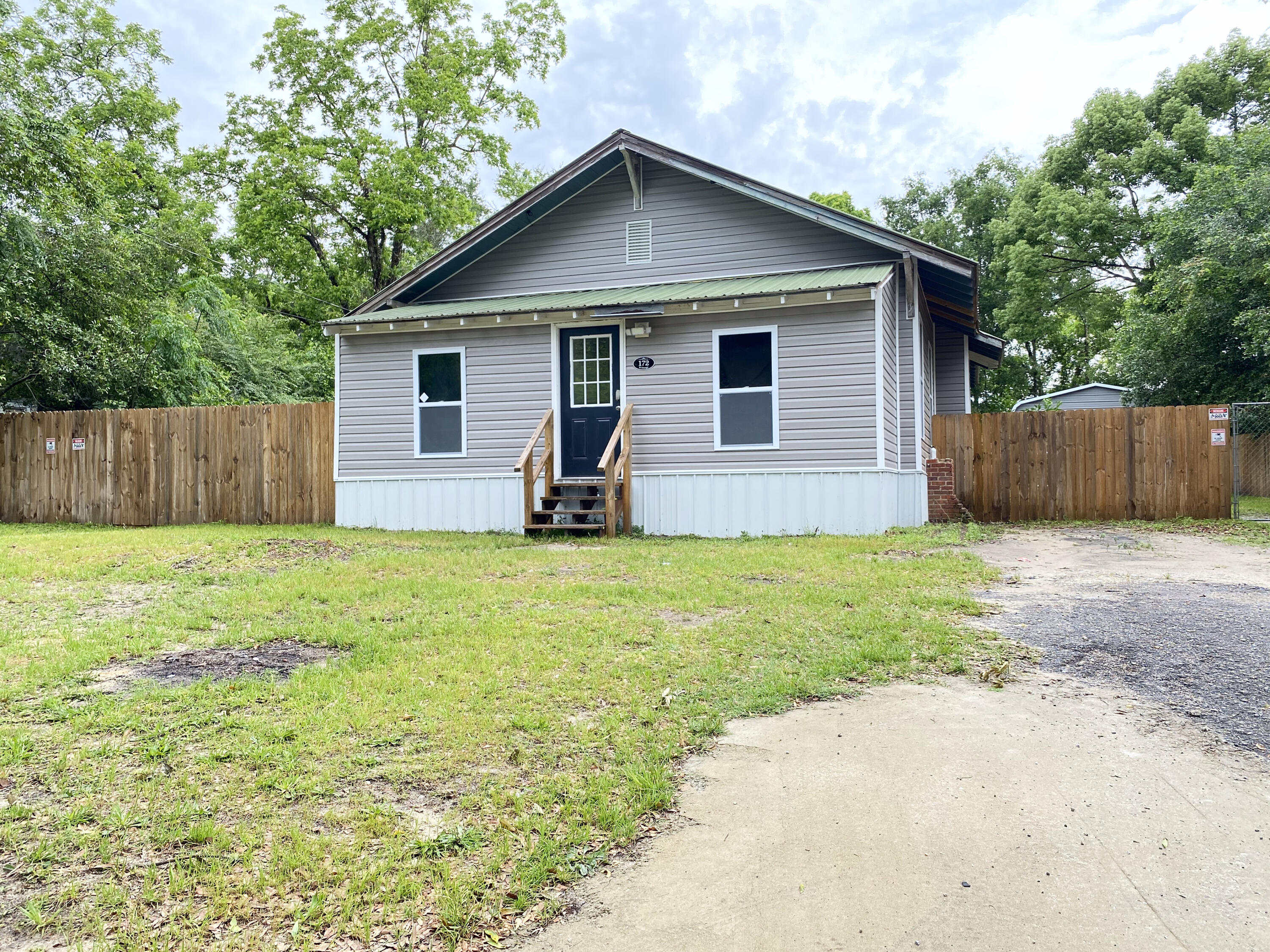 REDUCED AND MOTIVATED SELLERS A cute home built in 1900, is listed as 3 bedroom/2 bath but has an additional room that could be a 4th bedroom. The home has been recently renovated. It has brand new plumbing, all new electric and electrical updates, toilets, hot water heater, all new appliances, windows, brand new HVAC, metal skirting, LED lighting throughout, the guest bathroom remodeled, new privacy fence, 18x40 garage with concrete slab with electricity. The home also has original hardwood floors and tongue and groove walls.**The washer/dryer, 10 ft. dining room table and the 8 camera/video surveillance conveys.