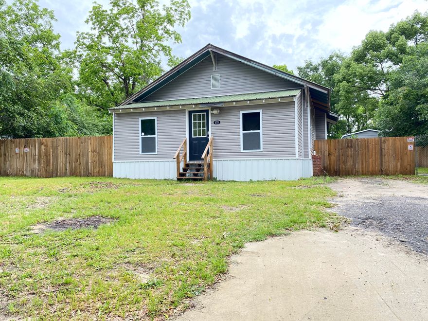 REDUCED AND MOTIVATED SELLERS A cute home built in 1900, is listed as 3 bedroom/2 bath but has an additional room that could be a 4th bedroom. The home has been recently renovated. It has brand new plumbing, all new electric and  electrical updates, toilets, hot water heater, all new appliances, windows, brand new HVAC, metal skirting, LED lighting throughout, the guest bathroom remodeled, new privacy fence, 18x40 garage with concrete slab with electricity. The home also has original hardwood floors and tongue and groove walls.**The washer/dryer, 10 ft. dining room table and the 8 camera/video surveillance conveys.