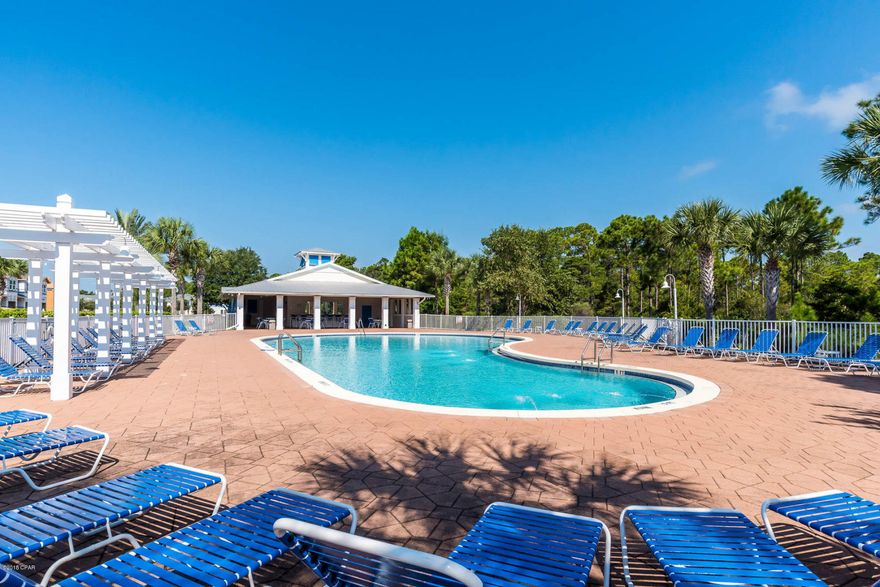 Gorgeous 3 bedroom, 2.5 bath townhome features Ivory cabinets, Luna Pearl Granite and Weathered Ashlyn vinyl flooring. BACKING TO THE CONSERVATION AREA - this location is breath taking. The Whisper Dunes community offers a well appointed cabana and pool but the beach is only a 5 minute walk.