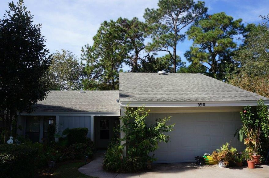 This single-story coastal cottage has a 2 car garage, screened in porch, private back yard, and tile floors in the main living areas. The spacious home has 2 large bedrooms and 2 baths. Low monthly fees. This listing is AS-IS. Sellers have gotten a quote for $1,500 to have the inside painted.