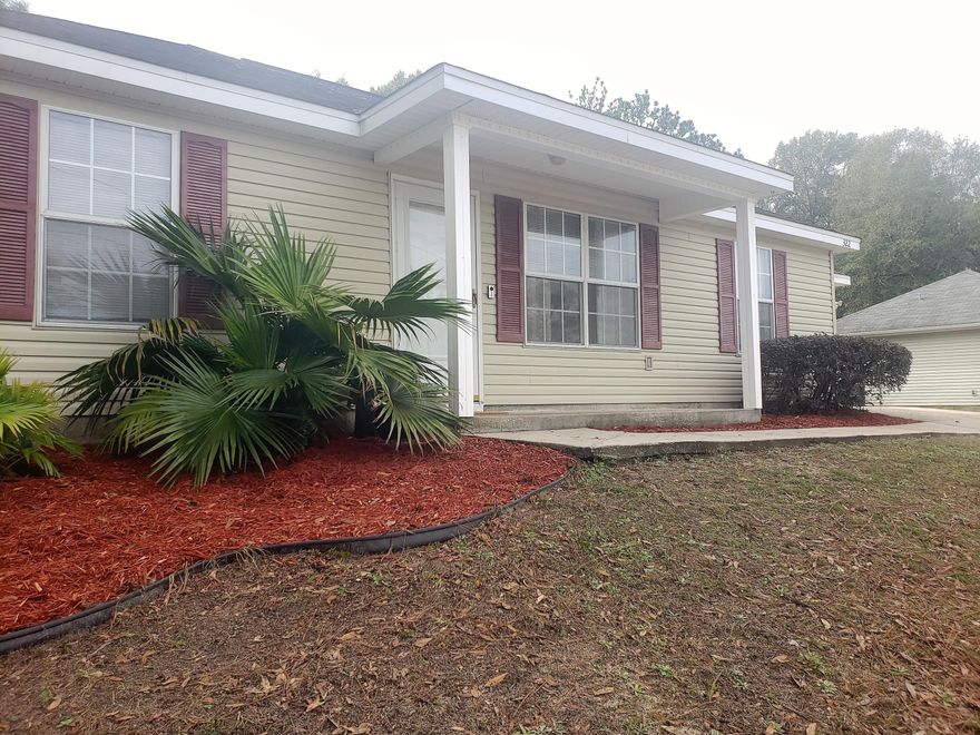 Quit Paying Rent ! ~ Grab this 3 bedroom, 2 bath split floorplan home for cheaper than paying rent. Walking in the front door you immediately notice the Cathedral Ceiling in the Living Room  making the floorplan feel more open & larger. This split floorplan home has Tile in the Living Room, Dining Room, Kitchen & Bathrooms ~ The Laundry Room is located between the Galley Kitchen and Garage ~ Kitchen is complete with Refrigerator/Range/Microwave/Dishwasher ~ From the Dining Area, the back door opens to a Screened Patio, continue walking out onto a large Deck great for entertaining ~ The backyard is fenced ~ Home has a 1 Car Garage ~ Extended Concrete Parking Pad ~ Vinyl Siding Exterior for low maintenance & Pex Manifold Water System. *Home is also a great rental for investor *