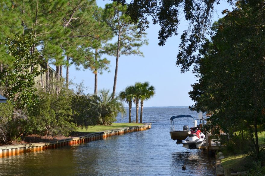 Calling all boaters, fisherman, and nature lovers. Must see this waterfront getaway on a deep water canal just a stones throw from protected waters of Alaqua Bayou which leads to the Choctawhatchee Bay. Property has a new dock/deck area overlooking the water. Selling As-is. Don't miss this opportunity.