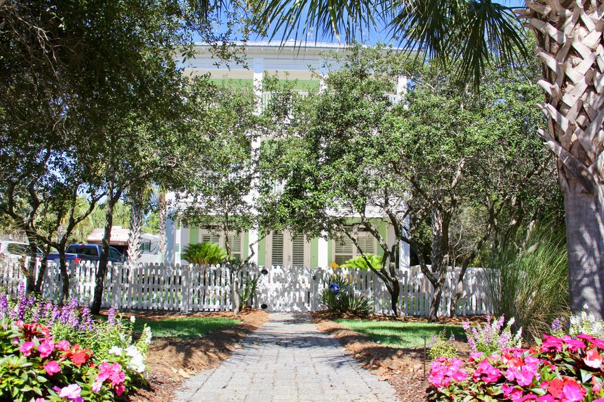 Here it is, a home that has NO HOA, nestled just a short distance to the beautiful Gulf of Mexico on a 1/4 acre lot, tucked away like a Southern Plantation home. Drive onto your brick paved driveway through your privacy gate accented with a white picket fence that can accommodate a motorhome , guests with a detached 2-car garage. That's not all, you have the convenience of your own heated swimming pool, plenty of seating all surrounded with brick pavers. Separate pool / storage building behind the garage for storage. Manicured landscaping front and back with fruit trees and grass for your children and pets. Let's begin the tour....large open porch greets you into your open concept living room / kitchen / dining area with laundry and guest bathroom on the first floor. You can enjoy those cold days or just a romantic evening with gas fireplace. Tiled floors throughout the first floor with an enormous kitchen with two refrigerators, 2 dishwashers and large porcelain farm sink.  The kitchen bar can seat 6 - 8 along with a dining table and breakfast nook for seating.  Exit out the french doors to a screened in porch overlooking the pool.  Going to the 2nd floor, there is a large master bedroom with a king bed, walk-in closet and a screened-in porch that over looks the pool.  Master bath features a claw-foot tub, separate tiled shower, double vanity with Kohler sinks, ensuite and tiled flooring throughout.   With two additional bedrooms, one features a queen bed and the other a bunk with single on the top and a double on the bottom.  Each bedroom has access to a  large covered, open porch that faces the street.  All bedrooms have carpet.  Guest bathroom has a tub/shower tiled surround with tiled flooring.  The 3rd floor features another master suite with screened-in porch overlooking the pool.  Master bathroom has a separate tiled shower, ensuite, claw-foot tub, double vanity with Kohler sinks and tiled flooring.  Gulf views from the decks and porches and master bathroom.  There are 2 guest bedrooms that open out to the covered porch with gulf views. One bedroom will have a queen bed and the other bedroom with bunks, top with a twin and bottom is a double.  Guest bathroom has a tub/shower combination with tiled floors.  Having a gas rinnai, your family and guests will have continuous hot water.  All three air conditioners have been replaced, one in 2015 and the other 2 in 2016.  These owners never rented the home, a place to relax and enjoy their privacy so close to the beach. Home was completely repainted and re-caulked last year.   It can accommodate at least 18 people easily with the sleeping arrangements ( a sleeper sofa, 2 king beds, 2 queen, 2 twins,  2 double and under the double is a trundle  which sleeps 2).  The owner's closet is on the first floor under the stairs and a storage closet on 2nd and 3rd floor.   You can walk to the restaurants, go for a bike ride on the bike path or go for a stroll on the beach within minutes.  There is also a 30 and 50 amp electrical hookup box for a motor home.