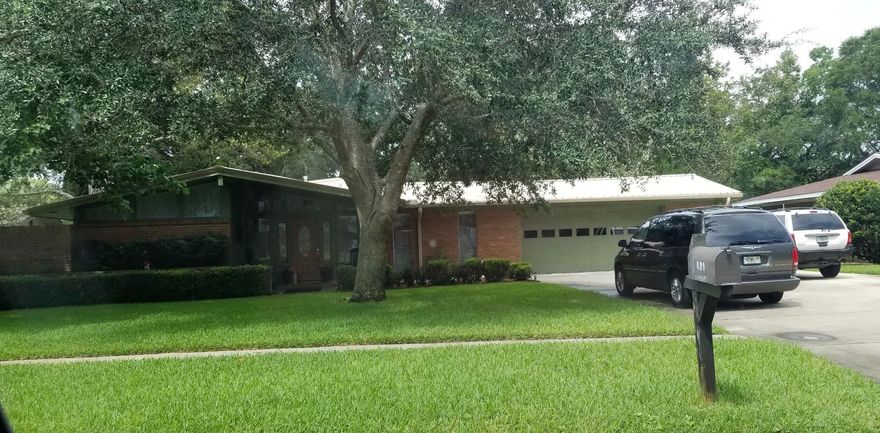 Pride of ownership shows in this home in the sought after Kenwood area next door to Kenwood Elem., city park, churches, & shopping. This well maintained home is ready for a new owner. All the big ticket items have been done: Metal roof, newer AC, gas water heater, kitchen, guest bath. Floor plan & open layout are great for any family & entertaining. Home features a formal dining area, center island, open eat-in kitchen, updated cabinets, some stainless appliances, granite counter tops, & tile flooring in the entire home. Formal living room has a ton of natural light & doors leading to a private lanai. 2nd living area, the Den, is accented w/matching brick & windows overlooking the backyard. The Master bed/bath have doors leading to another private lanai. The fully fenced yard is the place