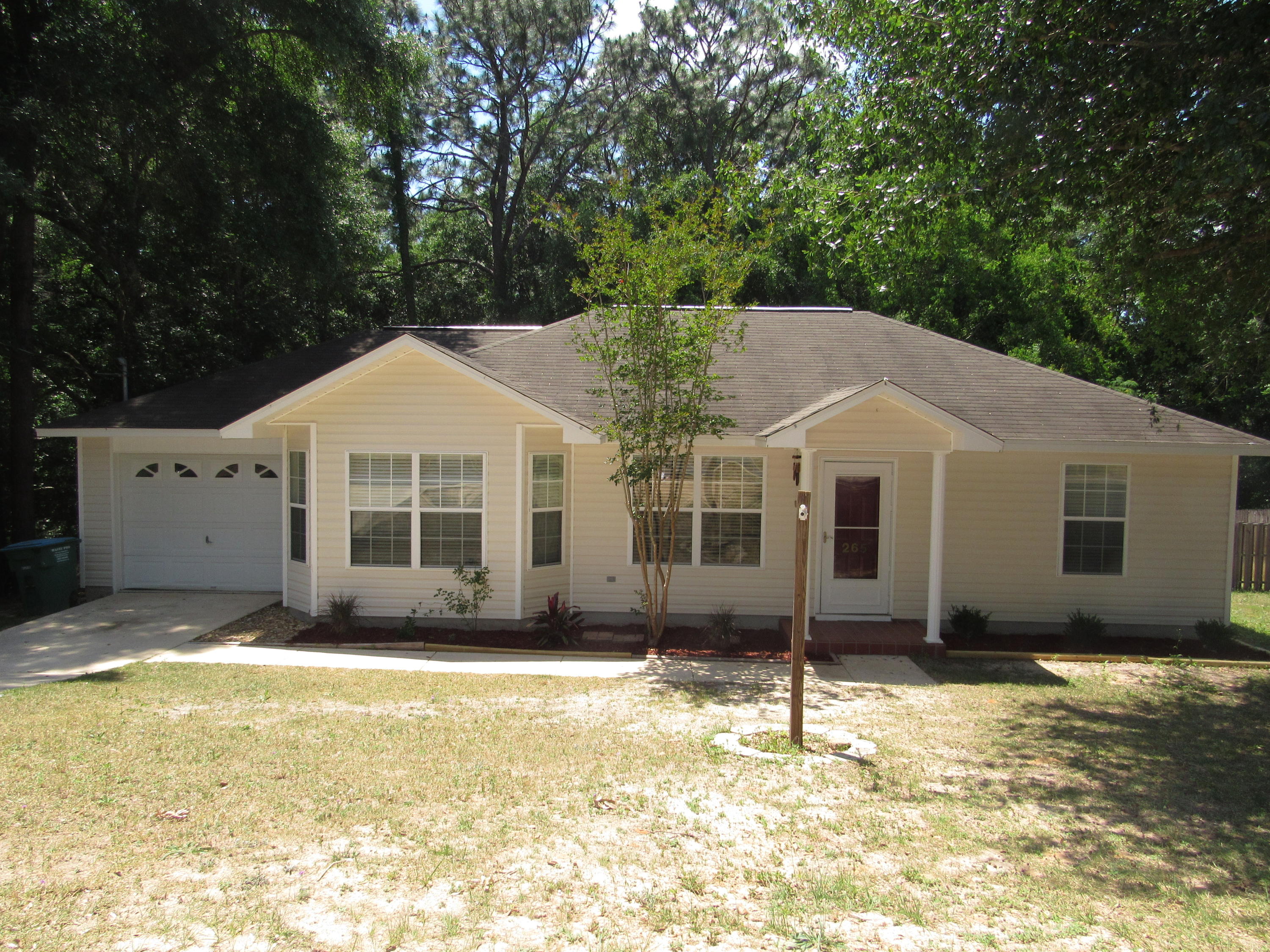 This home is MOVE-IN READY! A very nice home that is well maintained & is perfect for a first-time home Buyer or investor! The home has been freshly painted thru-out and has brand new carpeting in the master bedroom & bedroom #3. Laminate flooring in living room & bedroom #2, tile flooring in kitchen, dining room, both bathrooms & laundry room. Ceiling fans in all 3 bedrooms & in living room. The kitchen has a range, vent hood & dishwasher. Single car garage with work bench. The backyard has a clothes line and is completely fenced with plenty of room for outdoor gatherings. The Seller is offering a $400.00 one-year home warranty thru American Home Shield. Call your REALTOR today for a private showing.