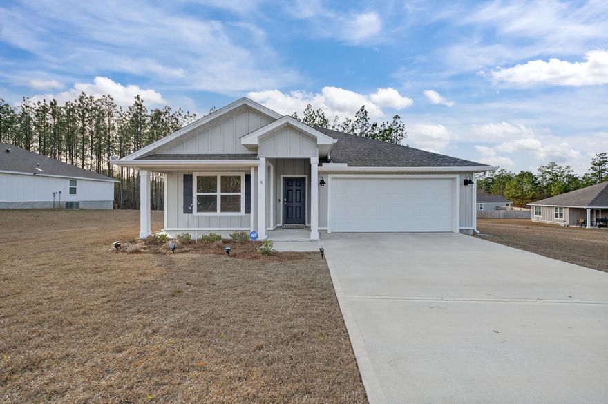 Built in 2023 & used as a second home, this one is truly like-new, this home has been meticulously maintained, the owner just added new gutters this year and this one has both front and back covered porches. Inside, the open, split-bedroom floor plan has a spacious living area, crisp white cabinetry, and a large kitchen island - perfect layout for entertaining or everyday living. Modern upgrades include a Smart Home Connect system, whole-home water softener, air purifier & a tankless gas water heater, delivering convenience, cleaner air and water, and endless hot water on demand. The primary suite offers a double vanity, low threshold shower, water closet, & large walk-in closet. A huge half-acre lot in Laurel Hill - just north of Crestview awaits!