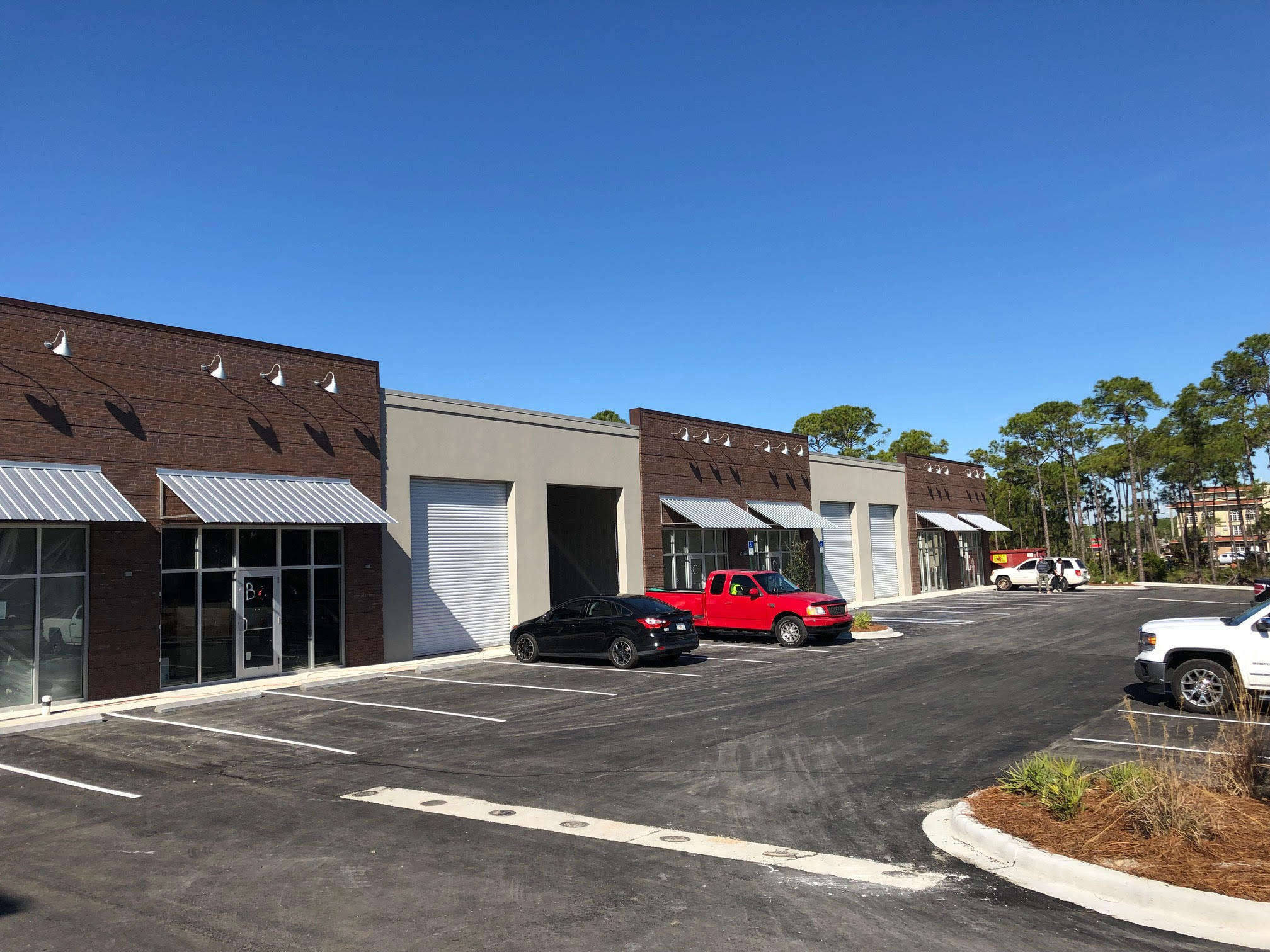 Emerald Coast Business Park will be the newest Office / Warehouse environment in the area. This site isstrategically located between Destin & Sandestin creating easy access to both markets and beyond. This facility will have glass storefronts and front loaded 14' roll up doors for easy access & loading. The exterior of the building will have a classic red brick & stucco facade and flat metal awnings over the front doors. The office portion of the space will be air-conditioned. 1 office , 1 restroom & large showroom. Target rent $12/SF Base Rent + $2.50/SF NNN + 6.8% sales tax. We currently have 3 available suites, Units B, C & D.