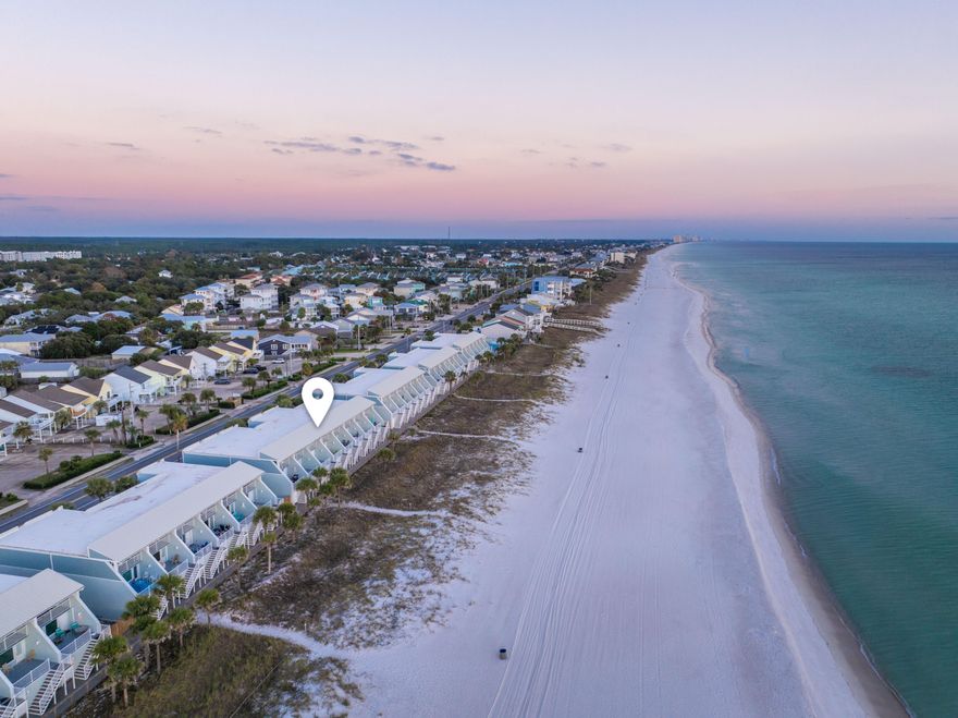 Experience beachfront living and strong rental potential in this beautifully updated 2-bed, 2-bath Gulf-front townhome on Panama City Beach. This turnkey, fully furnished unit comfortably sleeps up to 8 guests, featuring a sleeper sofa and a unique bonus bunk room hidden inside the primary walk-in closet&#65533;a guest favorite and revenue booster. Inside, the property has been thoughtfully renovated with high-end finishes including Florida Tile shower systems with ceiling-to-floor tile, upgraded vanities, modern lighting, and stone countertops. The primary suite offers double vanities with a dedicated makeup station, linen tower storage, a walk-in closet, and private balcony access overlooking the Gulf with unobstructed views. On the main living level, large windows frame breathtaking water vie