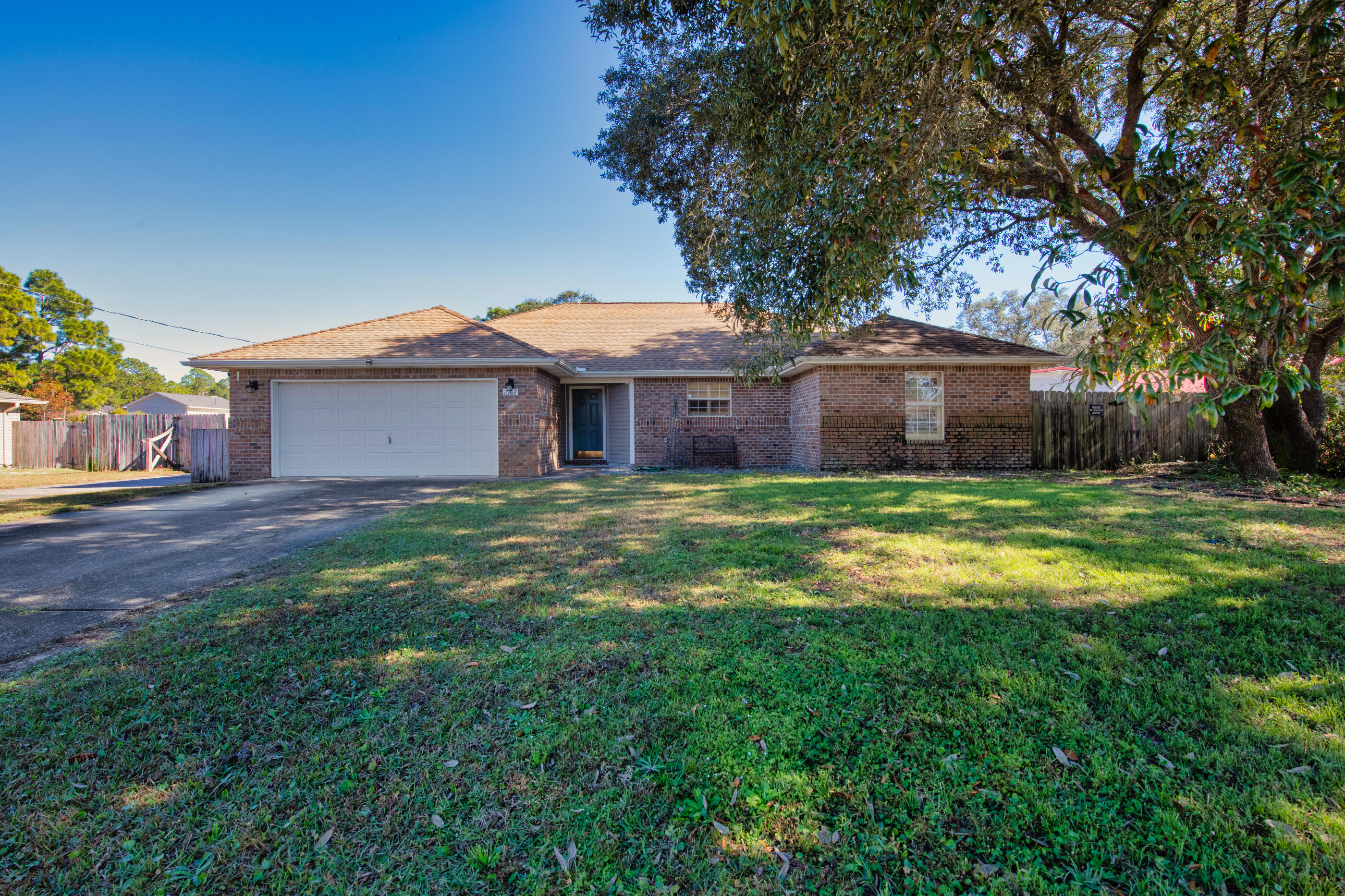 Spacious 3 bed/3 bath home in the heart of Navarre.  With an open floor plan and the option for 2 Master bedrooms, plus a separate mother-in-law living area behind the house giving you an extra bed/bath and kitchen.  The back patio is completely enclosed with a fireplace and walks out to the fully fenced back yard.  There is also a huge 17' x 36' RV garage as well as a 6' x 16' shed.  The Master Bedroom is carpeted, the rest of the home is either tile or LVP Flooring.  Close to schools, shopping and just minutes to the beach.