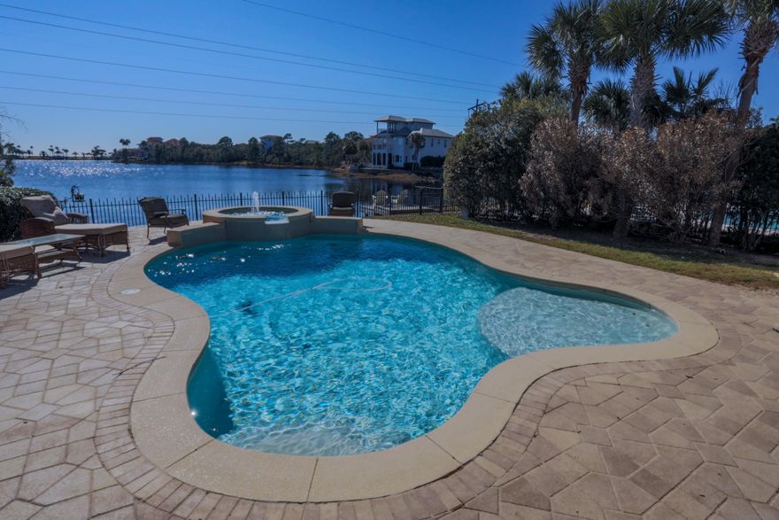 Savor Emerald Coast living from this beautiful home on the lake in Destiny East. The Mediterranean-style exterior complements the many features and conveniences inside: unique curves and angles for out-of-the-box flow, thick crown molding, modern kitchen, tray ceilings in some bedrooms, double sinks and separate shower/tubs, and so much more! Enjoy your own sparkling pool and spa overlooking the lake, or visit the huge community pool, tennis courts, playground, and all the wonderful Destiny amenities! Destiny's excellent location in central Destin between Highway 98 and the gorgeous white sand beach is another important plus. A great find for a family who wants to enjoy a quality, fun-loving lifestyle in one of Destin's best communities! Buyer to verify all specifics.