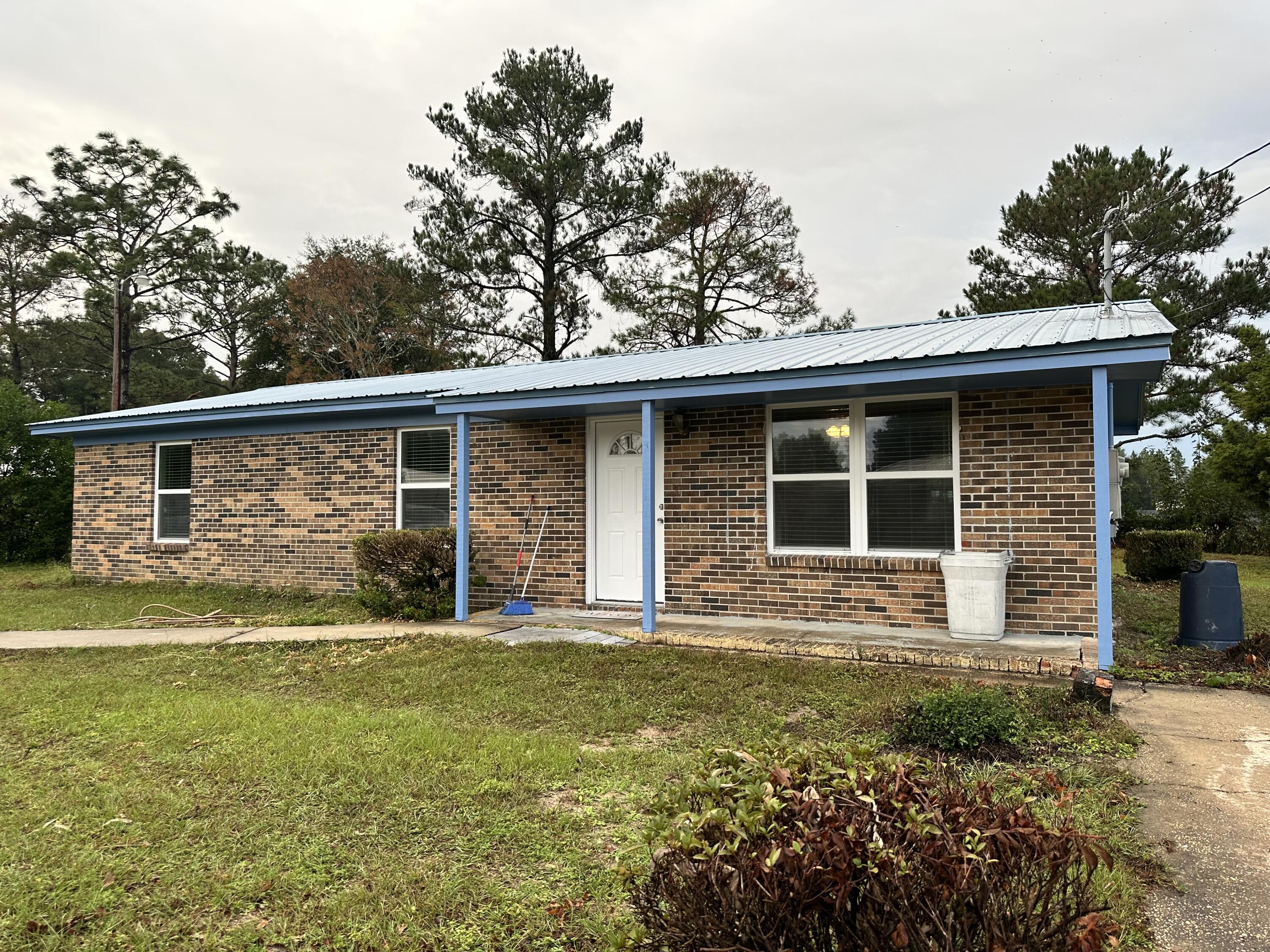 UPDATED PICTURES WILL BE POSTED SOON! Beautiful renovated starter home in DeFuniak Springs City limits. The home has updated HVAC, water heater, circuit breaker and metal roof. All new flooring, tile and carpet thought out the home. The home has all new windows, appliances, shower, vanities and all fixtures. Come check this home out! All measurements must be verified by buyers.