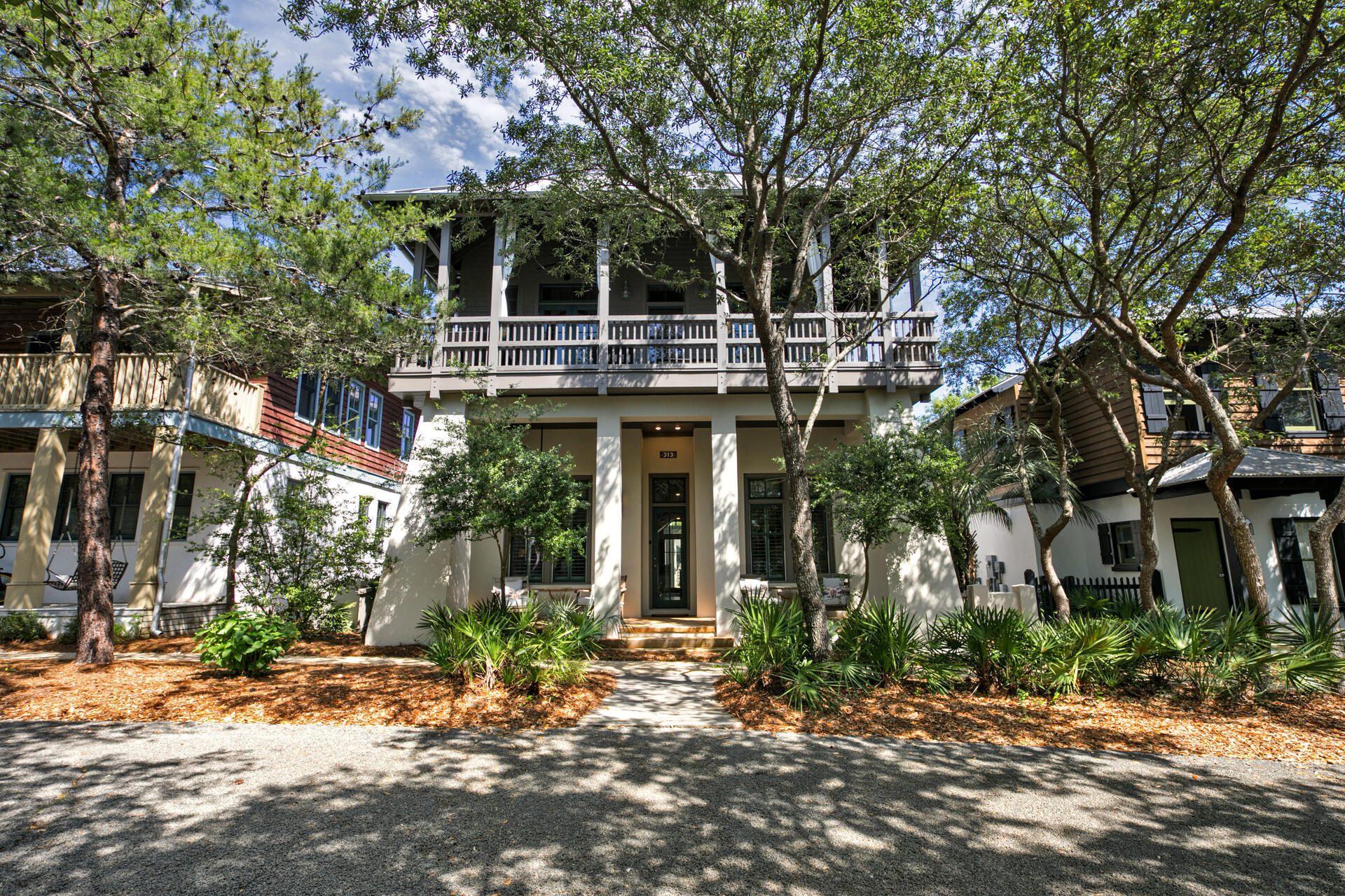 This south of 30A Rosemary Beach home with a private hot tub and pool has gulf views and is just a short walk to the east green beach access and minutes from the town center.  The natural wood craftsmanship creates a cozy and inviting environment for your family memories at the beach.  Boasting 4 bedrooms with an additional bunkroom/gameroom, this home can accommodate up to 14 guests.  There are 3 full parking spaces on this property as well.  From the back of this charming home, the outdoor area invites you in with the gorgeous pool and spa that features a complete outdoor kitchen with built-in alfresco gas grill, granite countertops, U-Line ice maker, and refrigerator. Plenty of seating options offer you space to dine, relax, and recline while taking in the infinity spa which cascades