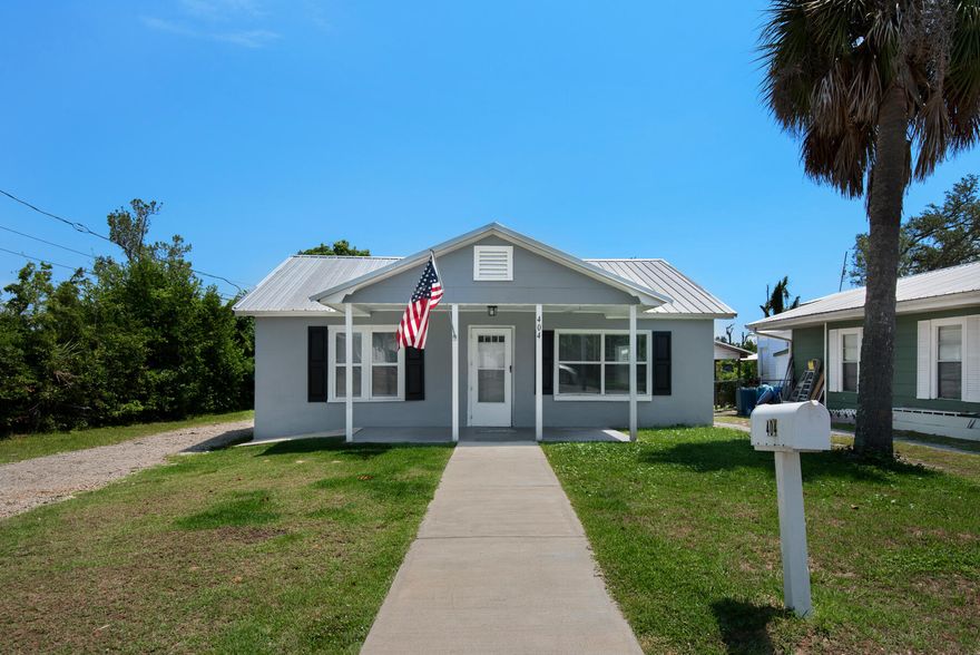 Adorable Florida Cottage.  Refreshed  in 2021.  All new kitchen cabinets, granite counter tops, vinyl flooring, windows, stove and microwave, tile tub surround and much more.  Just bring your furniture!