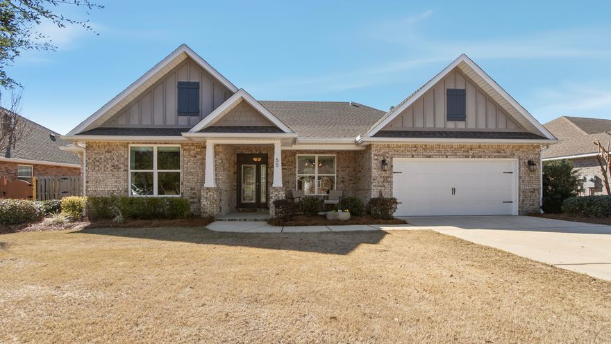 Welcome to 55 Sweet Tea Lane, a former builder's Model Home in the heart of Hammock Bay, Freeport's premier master-planned community. This stunning residence showcases custom upgrades and designer touches throughout, including eye-catching accent walls, a neutral color palette, and high-end finishes that create a timeless, upscale feel.Offering 5 bedrooms, 3 full baths, Sunroom, and 2,952 square feet of heated and cooled living space, this home is thoughtfully designed for both everyday living and entertaining. The open-concept layout is filled with abundant natural light from the many windows and features vaulted ceilings in the entry and main living area, creating a bright, airy atmosphere. Luxury vinyl plank flooring runs throughout the main living spaces and primary bedroom for both beauty and durability. Crown molding in the kitchen, primary bedroom, and office/flex room adds an extra layer of elegance. Throughout the home, you'll also find beautiful custom window shades and curtains, enhancing both privacy and design.

Other home features include: 
-Whole home non-electric Kinetico Water Softener and dechlorinator/chemical remover for safer water
-Whole home air purification system installed directly to the HVAC System
-Security System with sensors on all doors and windows, and outdoor cameras
-Built-in ceiling speakers in the living room, foyer, and primary suite
-Epoxy garage floor

The chef's kitchen is a true showpiece with quartz countertops throughout, a tile backsplash, ample cabinetry, a gas range, walk-in pantry, and a convenient butler's stationperfect for hosting and additional storage. The formal dining room also features a tray ceiling, adding architectural interest and sophistication to your formal entertaining space.

The spacious primary suite with an owner's retreat (extra flex space) offers a relaxing haven with tray ceilings, a spa-like bathroom featuring a fully tiled shower, a garden tub, dual vanities, and generous walk-in closet space. 

Step outside to enjoy the front covered porch, the brick paver back patio (ideal for grilling, relaxing, or entertaining). The home sits on an oversized, beautifully landscaped lot with a completely fenced-in backyard, providing privacy and plenty of room for pets, play, or even a future pool. A 2-car garage adds everyday convenience and extra storage.

As part of Hammock Bay, residents enjoy resort-style amenities including multiple pools, fitness centers, miles of walking and biking trails, playgrounds, sports courts, and community eventsall just minutes from schools, shopping, and the white-sand beaches of South Walton.

This is your opportunity to own a former model home loaded with upgrades in one of the Emerald Coast's most desirable communities where space, style, and lifestyle come together effortlessly. Call today to make this fabulous home yours! 
