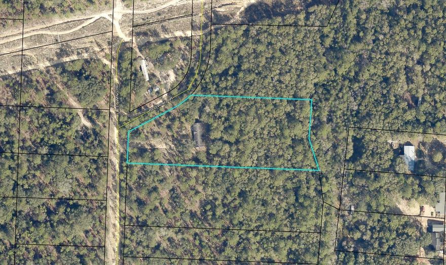 Vacant land close to interstate. Lot has an existing mobile home that we are not giving any value. You will need a 4 wheel drive to get to property.