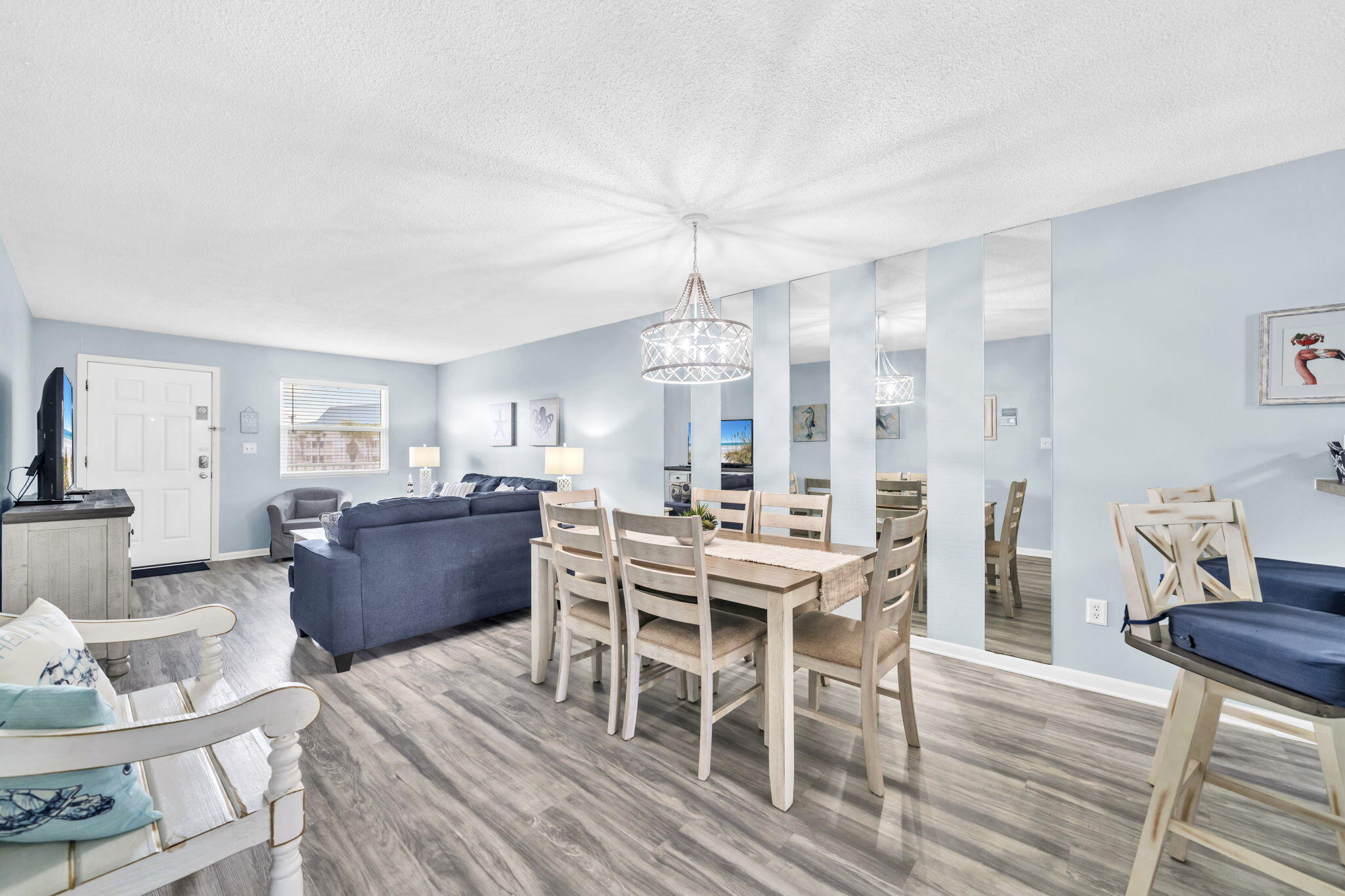 Your beach escape awaits - turnkey, fully renovated in 2022-2023, investment-friendly, and just steps from the sugar-white sands and emerald -green waters of the Gulf. This updated condo blends coastal charm with modern design, featuring luxury vinyl plank flooring, refreshed bathrooms with new tile and vanity, updated lighting, all-new furniture, new kitchen appliances and new HVAC system. Step out onto your balcony with pool views or enjoy resort-style amenities including a swimming pool, tennis and basketball courts, picnic and grilling areas, and shuffleboard. Whether you are looking for a personal getaway, a second home, or an investment property with rental potential, this condo offers low-maintenance ownership in a prime location-move-in ready and waiting for your next adventure The community also underwent a certified engineering overhaul and renovation to meet Florida's inspection and milestone requirements, giving buyers added confidence. Improvements include new insulation in walls for energy efficiency, and fresh paint, sealants and coatings on all exteriors. Also new hurricane rated windows, new railings, and new brick walkways at the pool. Exterior work is warranted through C-Sharpe Engineering, and all major improvements are complete. Seller paid special assessment in full.