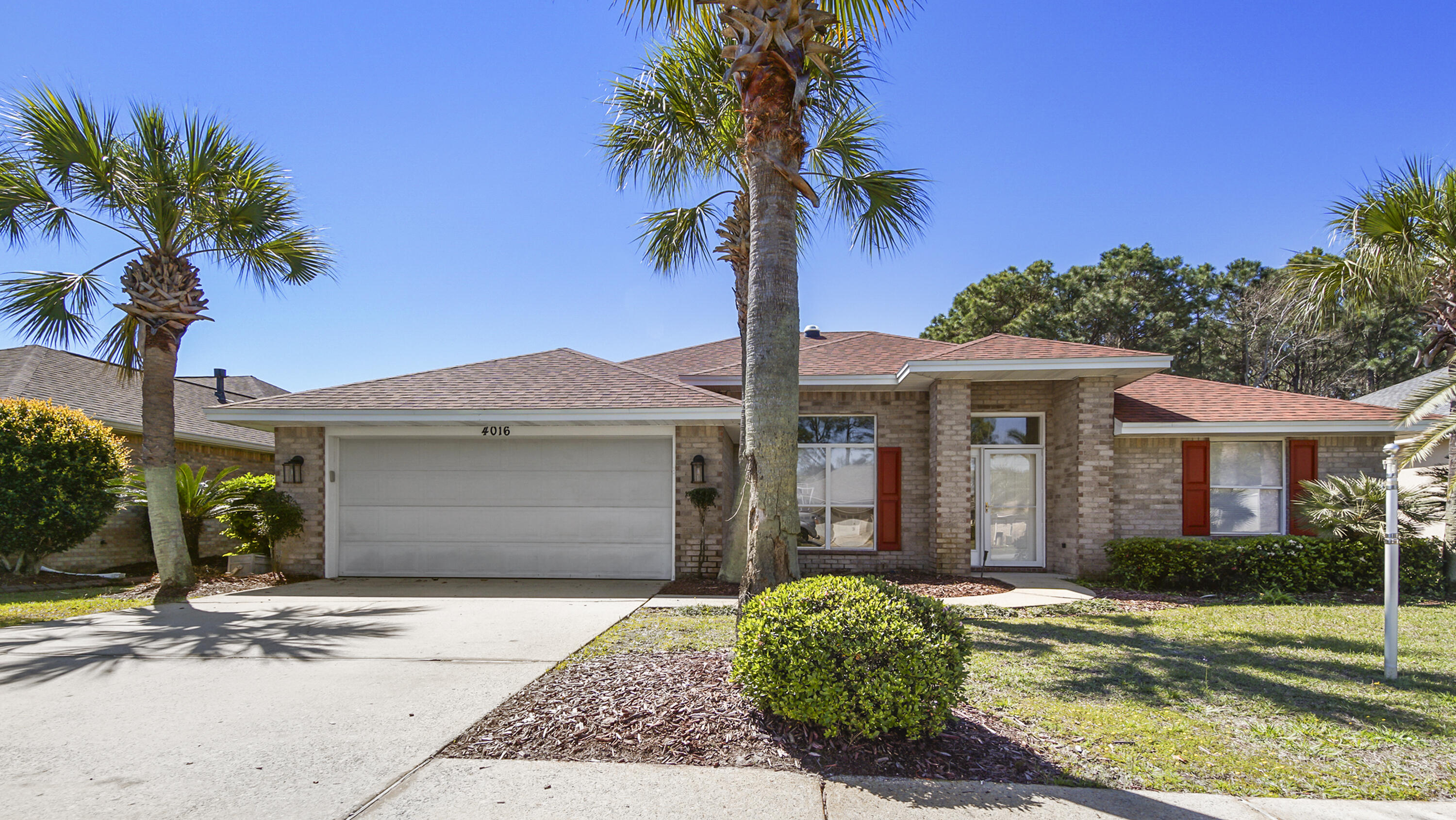 Set in a desirable lakeside neighborhood, this home offers a well-designed and spacious lay-out, perfect for both relaxation and entertainment. The split floor plan provides privacy for the master bedroom, while the remodeled kitchen serves as a central hub with its modern quartz countertops, stainless appliances, and ample pantry space. With an open connection to the living area, you can enjoy the peaceful lake views and natural light pouring in from the vaulted ceilings and skylight domes. The gas fireplace adds warmth in the colder months, complementing the serene setting. The formal dining room, with its high ceilings and elegant columns, creates a distinguished space for gatherings. The master suite is a retreat with its large bathroom featuring quartz countertops, a walk-in shower,
