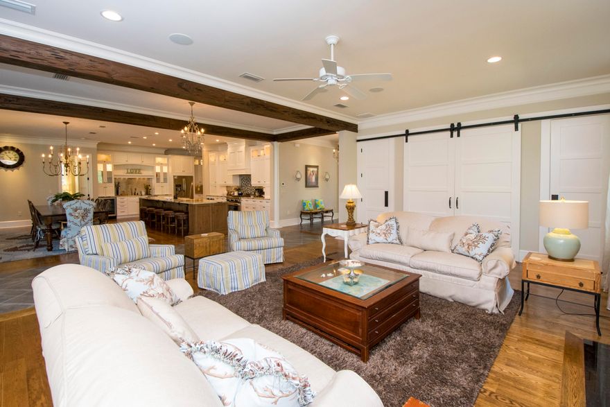 Luxury abounds this remarkable custom built masterpiece. This home is ''the best kept secret off 30A''. NO HOA with deeded beach access across the street. Double entry glass doors surrounded by gas lanterns (that have already patina-ed) leading into an impressive entrance foyer where you will pass by two large guests bedrooms with their own en suite bathrooms one of which has a steam shower! As you enter the massive great room with fireplace you will be amazed with the chef's gourmet kitchen, fully appointed with gorgeous granite counters including a 15' island, farm house sink, stainless appliances, gas stove, cabinets and drawers galore! Upper lighted glass cabinetry, full entertainment bar with a wine frig, automatic ice maker, glass cabinets with granite counters, desk area as well! 12 ' farm house inspired dining table very comfortably seats 12, LOTS of windows throughout, Pecky Cypress ceiling beams, real hardwood flooring and custom designed floor tiles throughout. Split bedroom plan including an adorable 4 bed Bunk room with full en suite bathroom.  Private Master bedroom with doors leading out to the best of outdoor living! Dive into your 15 x 30 heated pool or relax in the hot tub, full summer kitchen with built in Viking grill, ice maker, refrigerator and sink. Unique fun pool 1/2 bathroom, custom built swing bed, gas fireplace and all fully screened in.  Over sized seating area with comfy sofas and chairs for lounging, dining table set up and 6 fabulous loungers along the pool. All this backs up to a fully wooded area...so beautiful at night with all the cozy string lights framing the pool screen ceiling frame...and this home comes fully FURNISHED! Security system, central vacuum system, private golf cart garage door entrance , double car garage, auto sprinkler system, brick pavers cover the entire driveway including along the side of the house just for your golf cart. Much more to see and love!  BUYER/S TO VERIFY ALL INFORMATION CONTAINED IN THIS LISTING.