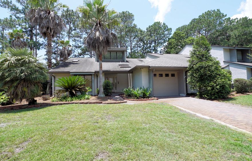 CAREFREE LIVING CAN BE YOURS AT GLENEAGLES GREEN. This is truly at the heart of Bluewater Bay, where you're only a short walk or golf cart ride away from the golf clubhouse, pickleball courts, swimming, tennis, and the marina. This home is a desirable end unit with a split bedroom plan and neutral paint colors throughout. The tile entryway overlooks the spacious living area, featuring soaring ceilings, which is also open to the dining area and Florida Room. The wet bar area is situated to the right of the foyer with glass shelving and mirrored walls. The kitchen features numerous cabinets that have been recently updated with new shaker-style doors, granite countertops, a breakfast bar, and a nook overlooking the backyard. The main bedroom suite has a cathedral ceiling, (click more now) A private entry to the Florida Room through sliding glass doors, an adjacent updated bath with two closets, a dressing area, his and her sinks, two skylights, and a shower. The guest bedroom is located on the other side of the house, adjacent to the updated guest bath. Outside, there is a lovely patio area. A one-car garage completes the package.