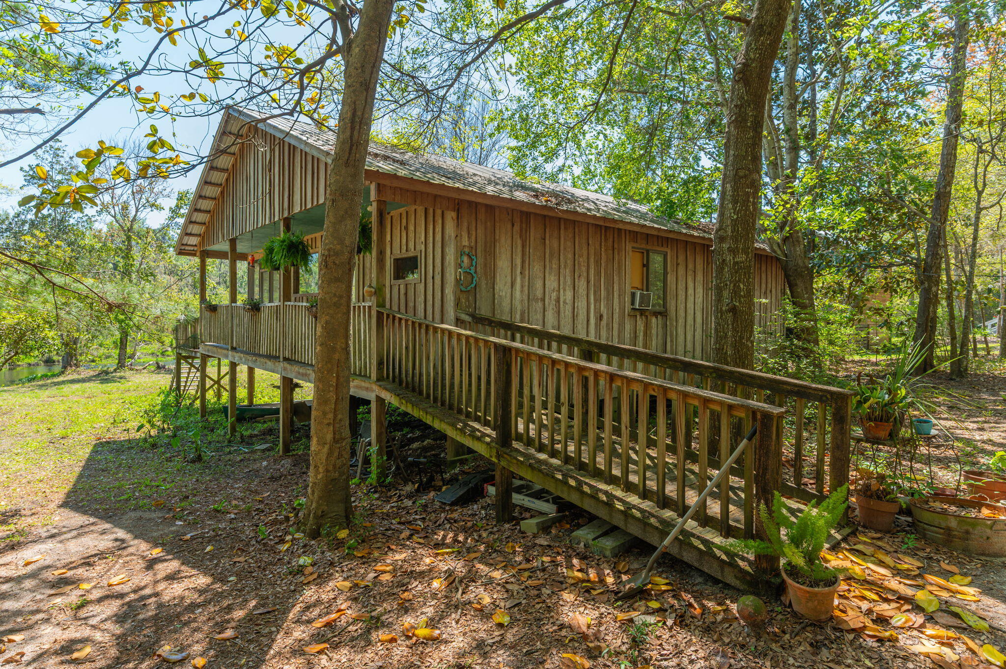 This canal-front gem offers a rare setup ideal for multi-generational living or rental income potential--featuring a 2BR/2BA cabin and a 1BR/1BA tiny house on over half an acre in a peaceful neighborhood. Located just 10 minutes from Choctawhatchee Bay and 15 minutes from the sugar-white sands of the Emerald Coast, it's a great blend of relaxation and adventure. The main cabin offers rustic charm, while the tiny house adds flexibility for guests or tenants. With over 190 feet of direct canal access, you can fish, kayak, or simply enjoy the tranquil water views. Priced to sell and sold AS IS, this unique property is full of opportunity.