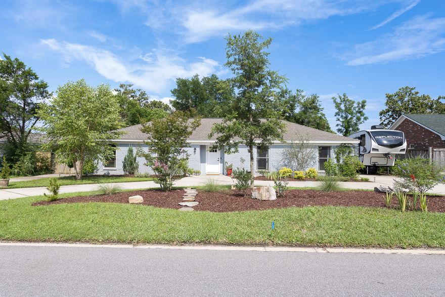 FABULOUS FIND IN PROPER! Perfect setup for multi-generational living in one of the most desirable and convenient locations.  Just a short walk to Shoreline Park, the Gulf Breeze Rec Center, and the splash pad.  This 70's ranch is now an open floor plan to meet today's living needs. Gorgeous Lifeproof LVP floors in communal areas and   three bedrooms of main house. LVP in the Mother-In-Law/Guest Quarters apartment. Yep, it has an ATTACHED BUT COMPLETELY SEPARATE APARTMENT connected by the shared Laundry Room. This provides a private retreat for guests or live-in family members, and it would also make a great rental unit.  Updated kitchen design with beautiful soft close cabinets and drawers, LED lighting, stainless steel appliances, and a HUGE kitchen island.