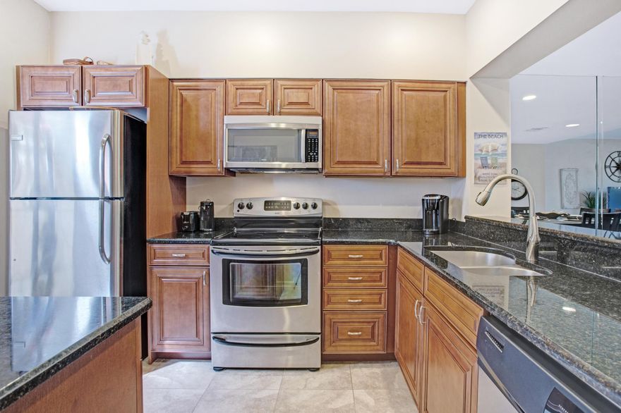 Beautiful lakefront resort home featuring an updated kitchen with granite counters, new cabinetry and stainless steel appliances. The kitchen is open to the dining room/living combo featuring a new high top 6 person dining table, sofas and entertainment console. New patio doors and new travertine tile flows seamlessly throughout the main floor. To include a golf cart.   Owners are able to relax in the private front courtyard or out on the open back patio with views spanning across Horseshoe Lake. Beachwalk Villas is located on the beachside of Sandestin Golf & Beach Resort within 1/2 mile to the beach access. Owners can also enjoy the warm days lounging at the Beachwalk community pool located on the same street. Fabulous dining & shopping in The Market Shops is directly across the street!