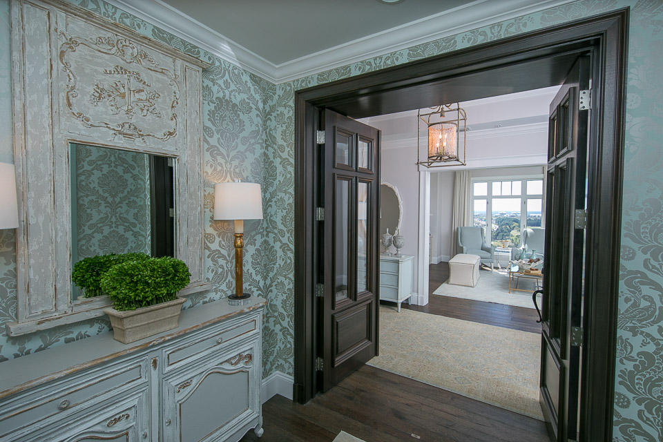 Inspired by beautiful homes gracing the cover of ''COASTAL LIVING'' magazine, the excitement begins the second you enter this custom residence. Remodeled in 2016 with care and pride, applying the finest materials, from the ''African Sapele Mahogany'' front doors of your private entryway, to the imported marble flooring in all three baths and kitchen. The Master Bath has Carrara marble counter tops, and the guest baths have high end granite counter tops. The Gourmet Kitchen with ''WOLF/SUB ZERO'' appliances compliment the the custom cabinetry made to fit around the new appliances with no fillers. Premium ''Buckskin Oak'' hardwood floors take you from the private entryway, into the Den with floor to ceiling built in library/book shelves and an electric fireplace, adding that perfect touch.
