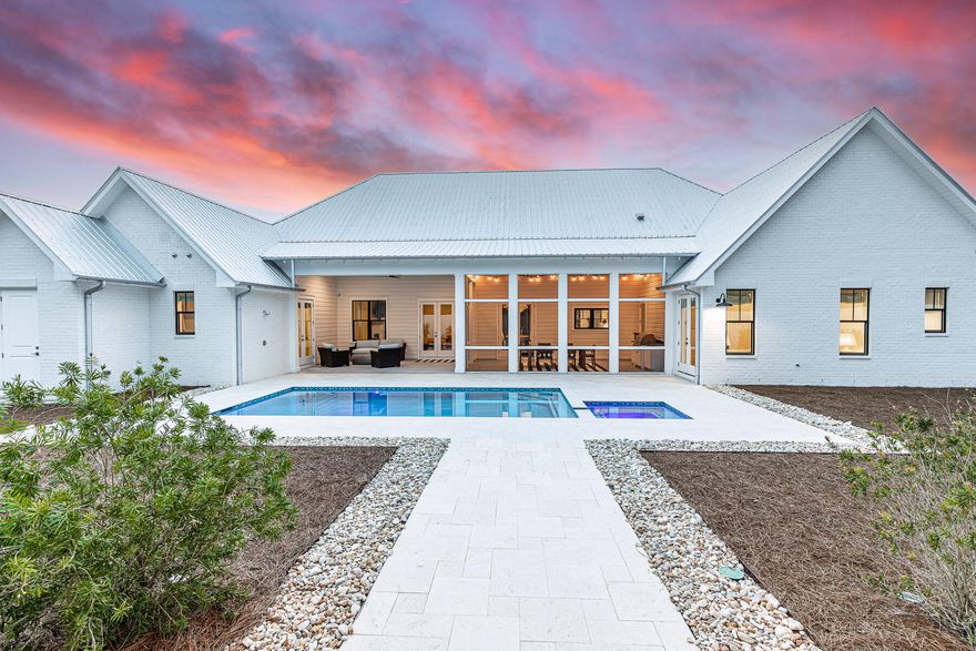 This newly built one story luxury home was designed with privacy in mind set in Blue Mountain Beach on a 1/2 acre lot with 2 car oversized garage. This home features 5 bedrooms and 4.5 bathrooms with additional office/flex space making it ideal for primary residence, second home or rental investment. The upgraded lighting, window shades and furnishings are the epitome of luxury in this private beach oasis.  The north wing of the home features a large primary wing with access to patio, large double vanity bathroom, spacious walk in closet to oversized laundry room. This layout opens to pool and patio as well for a true indoor/outdoor living.  The open floor plan with a chef's kitchen features high end appliances with butlers pantry, wine fridge, beverage fridge and plenty of storage.  The large island on the kitchen leads to dining area with custom lightening above leading into sitting area with fireplace. This room has a flex space that could be an ideal office or bunk room for additional guests. The living space is extended to large screened in porch overlooking pool and spa featuring summer kitchen for ultimate in entertainment. The outdoor pool is an oasis with another fireplace overlooking the peaceful setting with additional storage and an outdoor shower. 

On the south wing of the home are 4 bedrooms and 3 full bathrooms. This provides a great space for guests or family members. The home is set back from the road on this large lot offering privacy from each room. 68 Mountain Top Dune Drive is offered furnished as shown with high end furnishings and custom drapery from local Shade and Drape Company in Blue Mountain Beach. 

The garage is oversized wit one bay measuring 25 feet in depth to accommodate a 23 foot boat or Tesla Cyber Truck.  This location is in the non HOA community of Blue Mountain Beach keeping of cost of ownership low. This residence is surrounded by homes on similar sized lots offering peace and tranquillity just off 30A.  There are multiple beach access areas just at the end of the road as well as miles of trails in Point Washington State Forest less than .5 from the home.  Relax by the pool after a long day at the beach or hop on your e bikes (new and included in sale) to explore all the surrounding towns along 30A.  