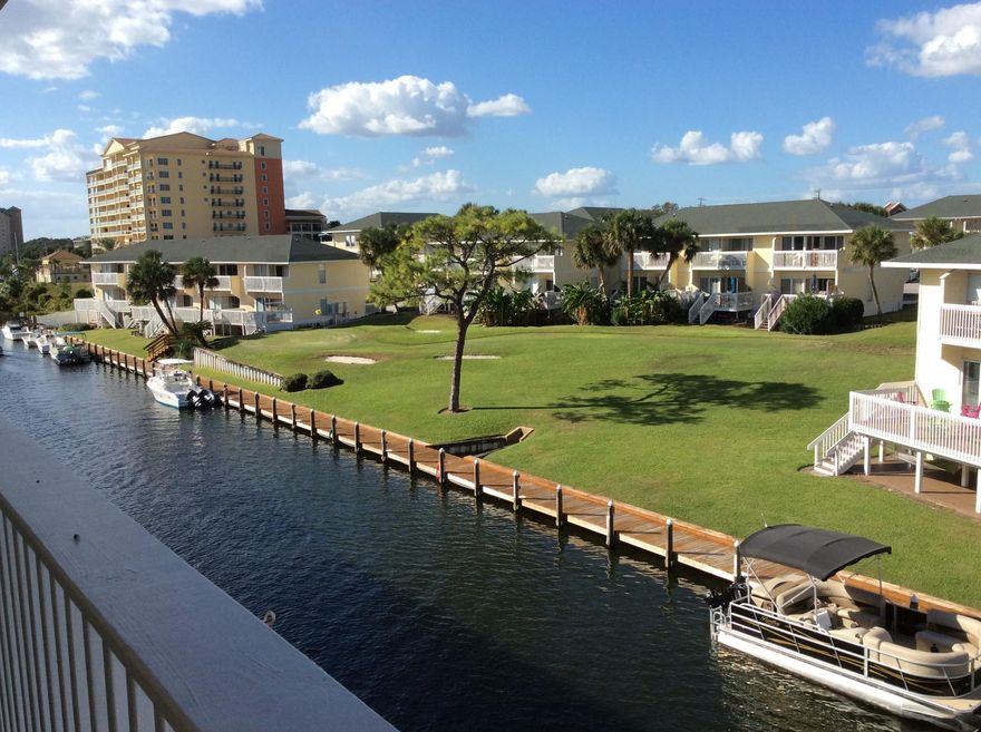 Terrific one bedroom condo on the CANAL with great views! Numerous upgrades, lovely furnishings, fully furnished and rental ready, this is a great condo! Granite counter tops, tile floors, washer/dryer, electric fireplace, and just steps from all SPC's many amenities. SPC is a low density residential style resort occupying 43 acres in the heart of downtown Destin. Favorite amenities include 1100 ft beachfront w/seasonal beach chair/umbrella service, beachfront grill and bar, 5 pools, 6 tennis courts, canal docking by reservation, marina for long term slips (by availability), and the favorite 9 hole par 3 pitch and putt golf course. All this within walking distance to numerous additional restaurants,shopping areas and local attractions.